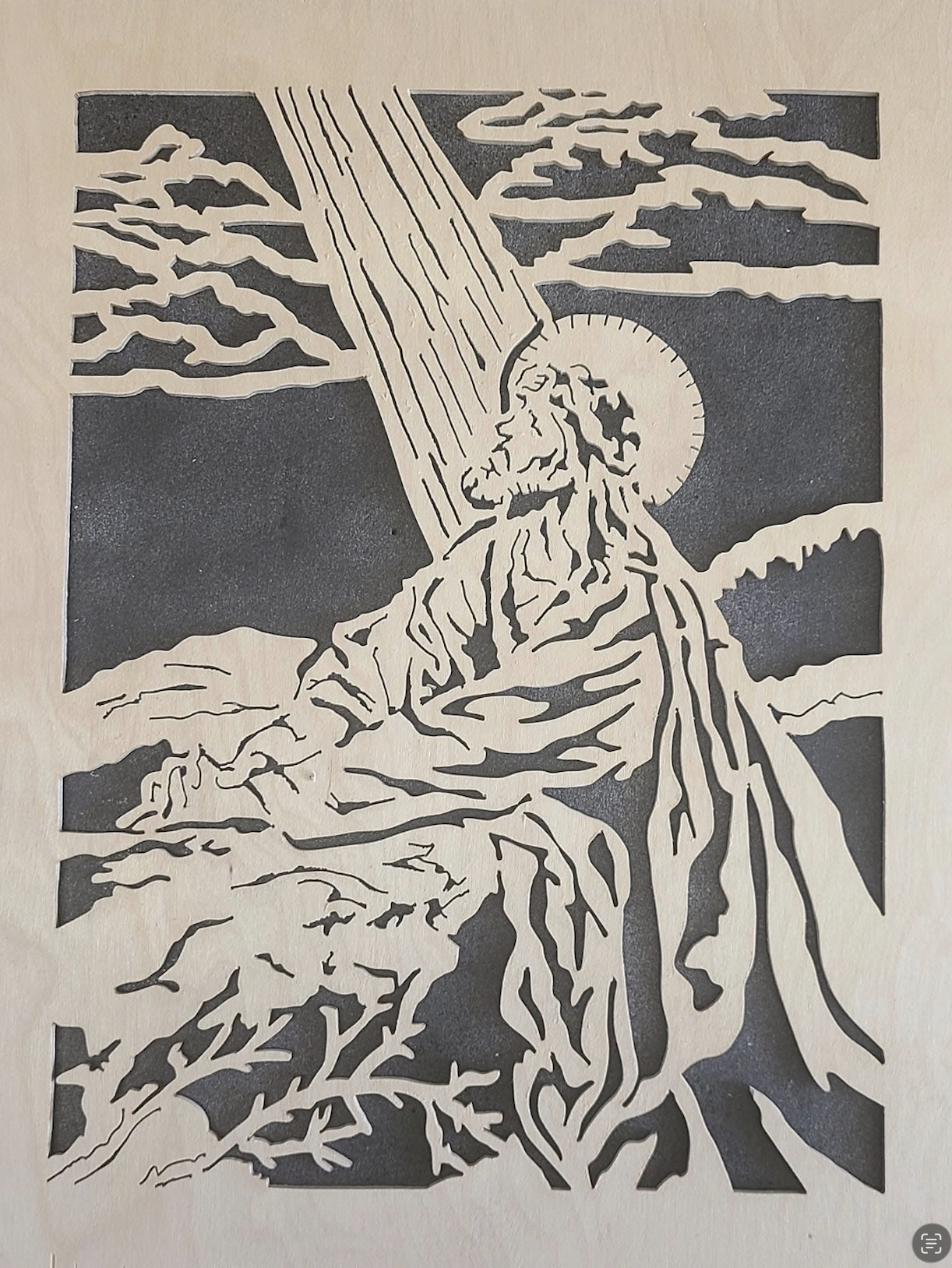 Intricate fretwork scroll saw portrait of Christ in prayer with heavenly rays
