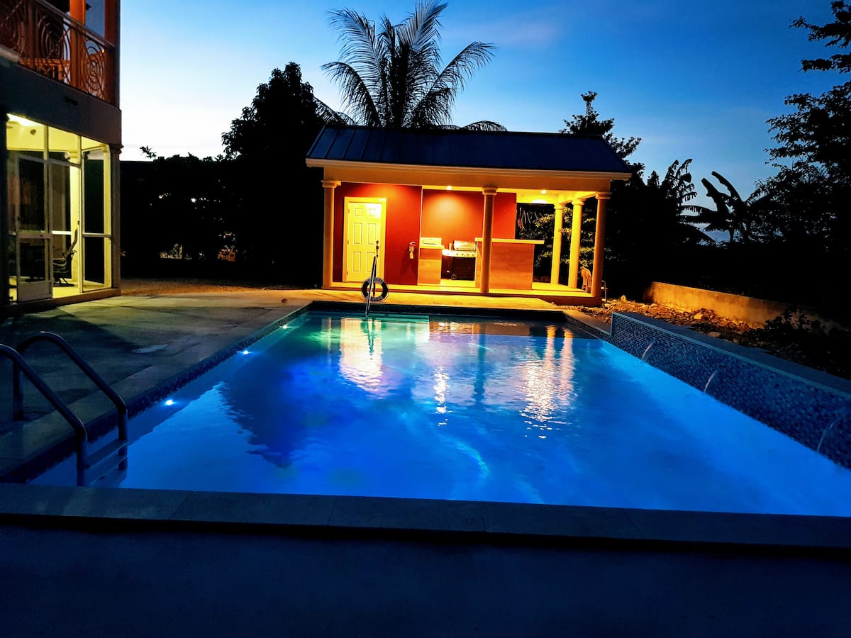 30ft pool and gazebo lighted at night