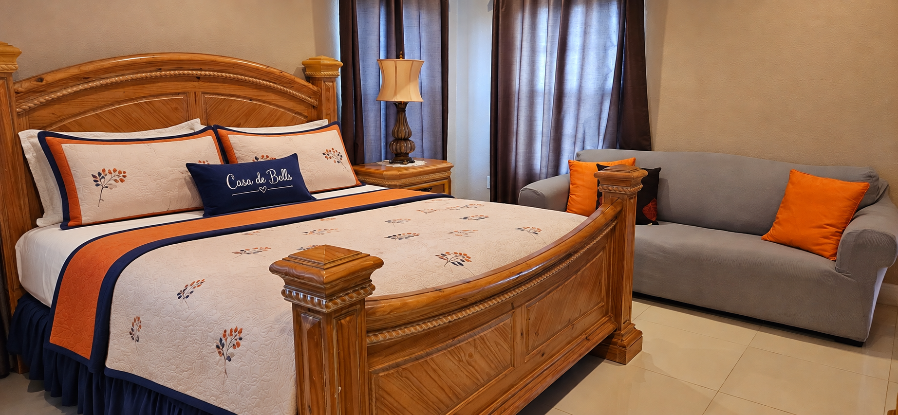 Master Bedroom 1 with king bed, custom Casa de Bells pillow, and seating area