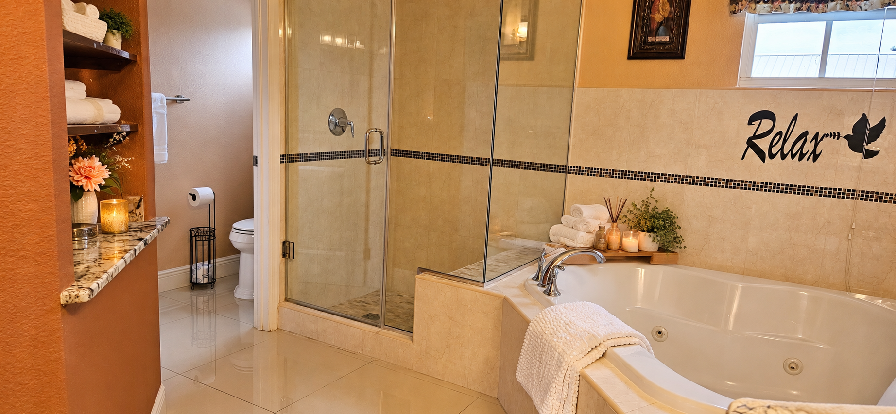 Master bathroom: corner jacuzzi soaking tub and walk-in glass shower in the master ensuite