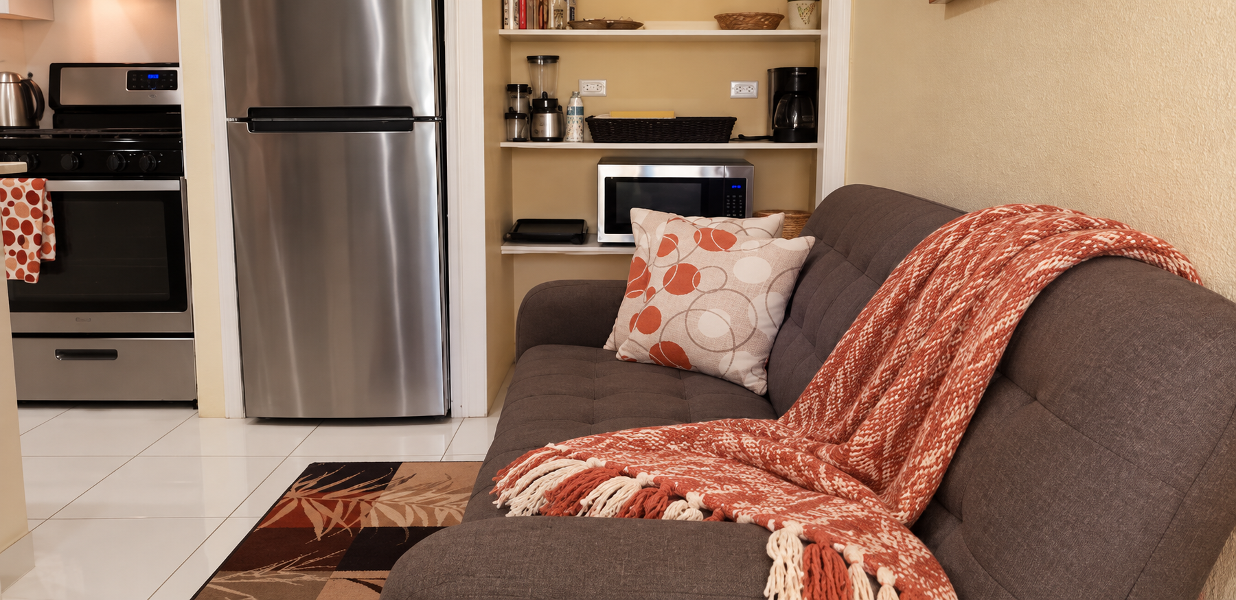 Open living area with comfortable seating and view into the kitchen