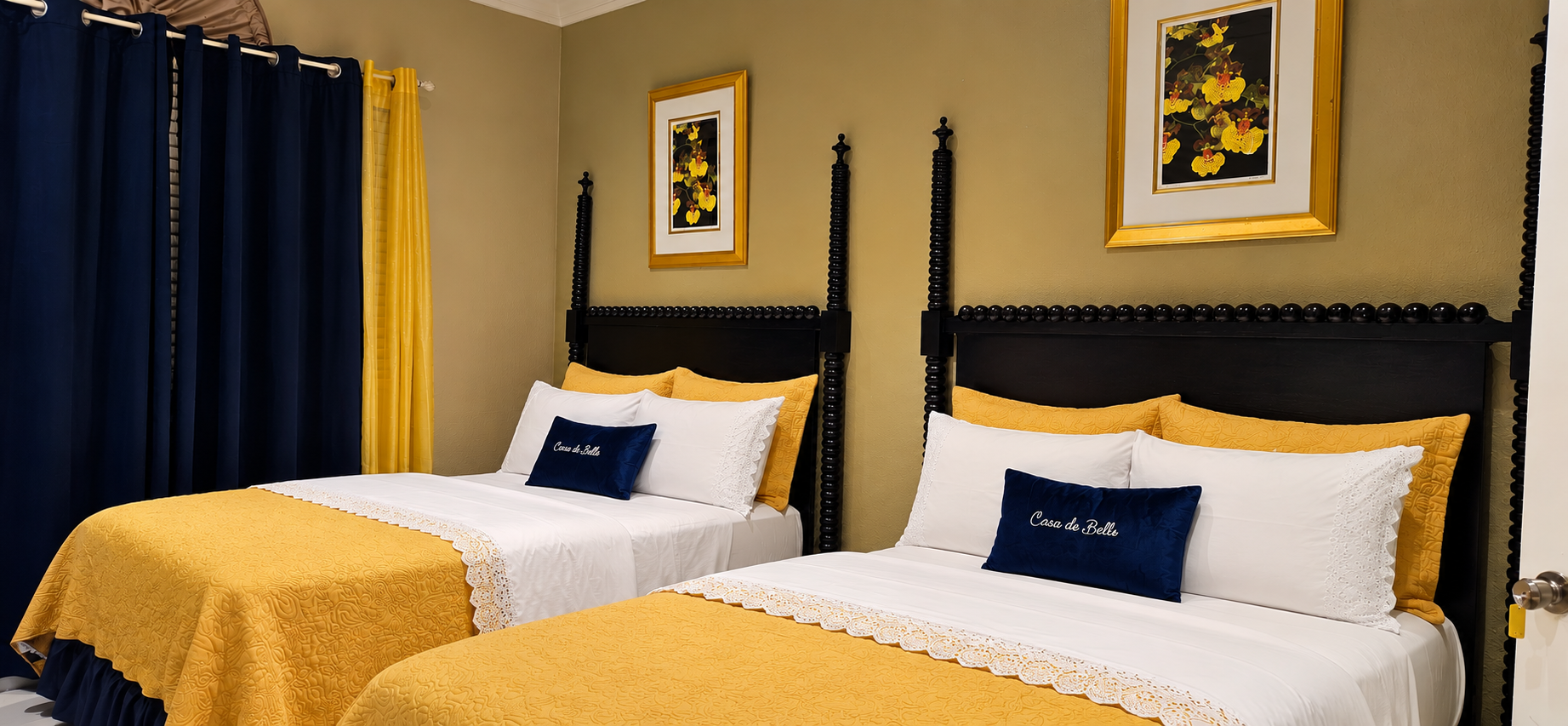 Bedroom 3 — spacious guest bedroom with two four-poster beds and custom Casa de Bells pillows