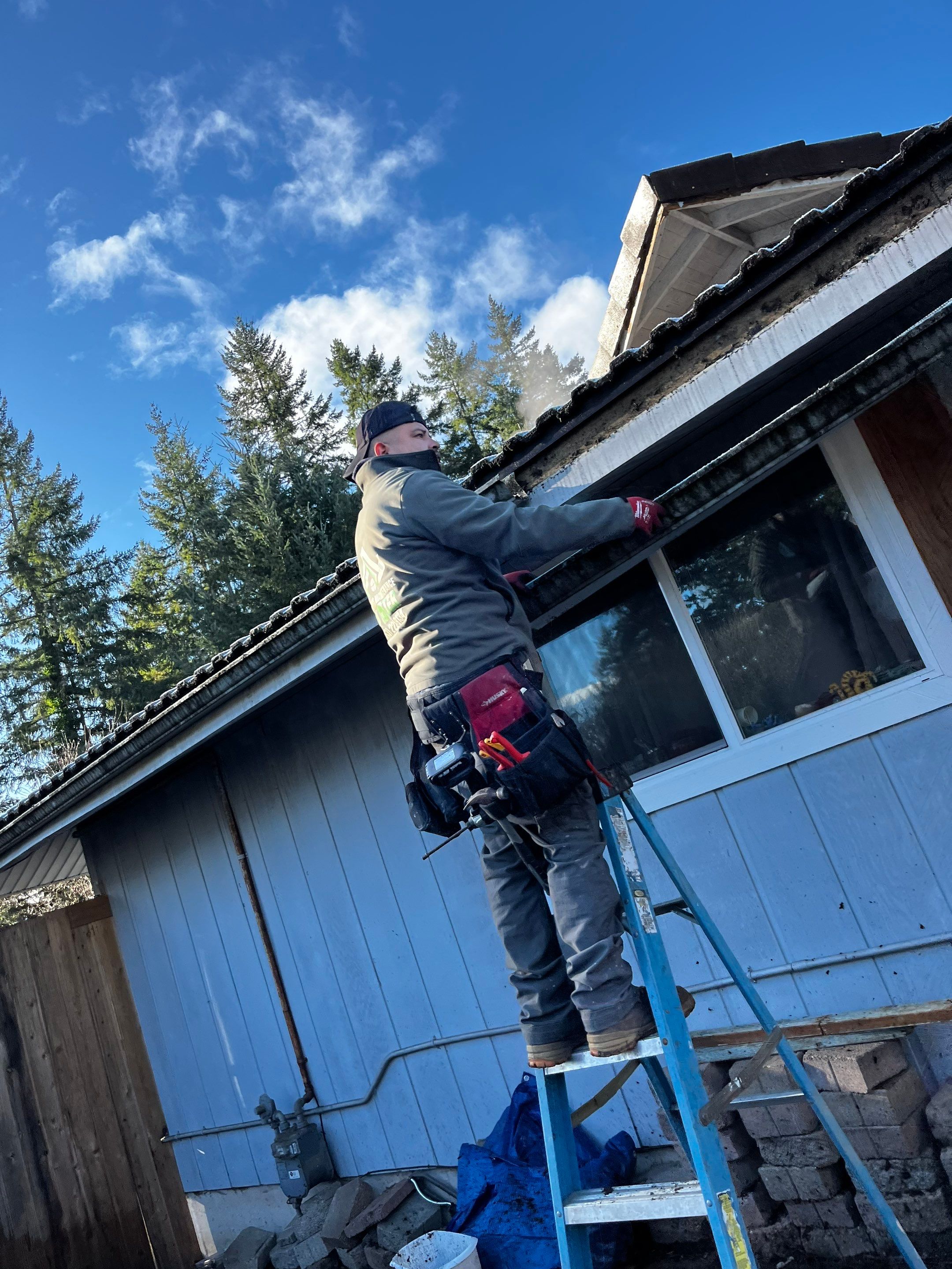 Homeworks Restoration technician installing seamless aluminum gutters