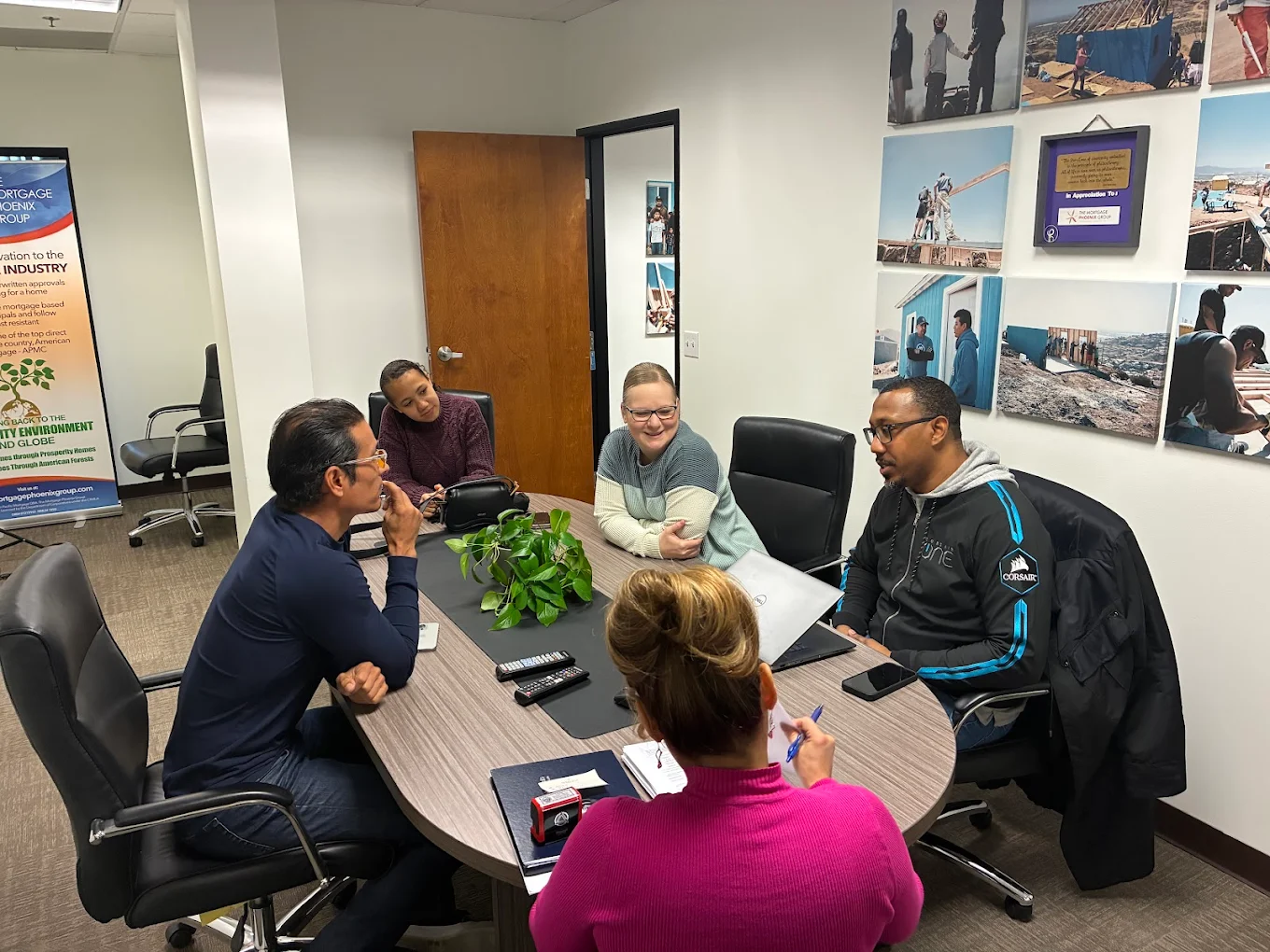 Elizabeth De Rosa reviewing documents and facilitating signings with clients