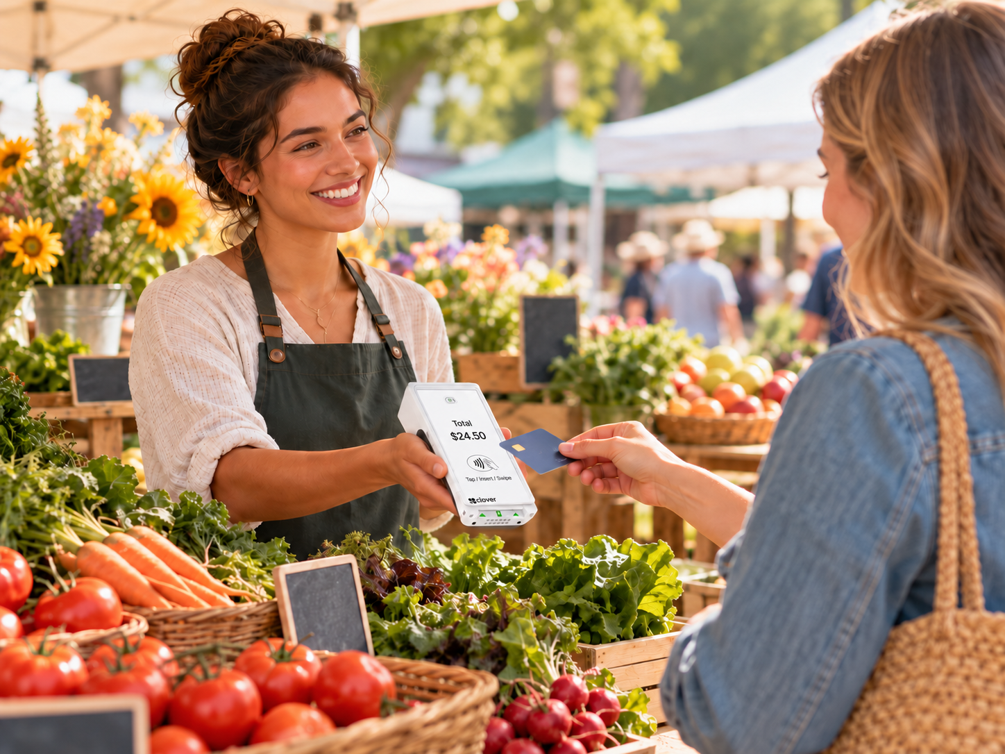 Farmer's market vendor accepting mobile contactless card payment with Clover Flex