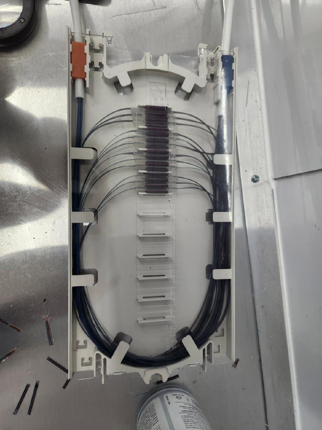 Stacked fiber splice tray with protective cover and numbered fusion splice sleeve channels