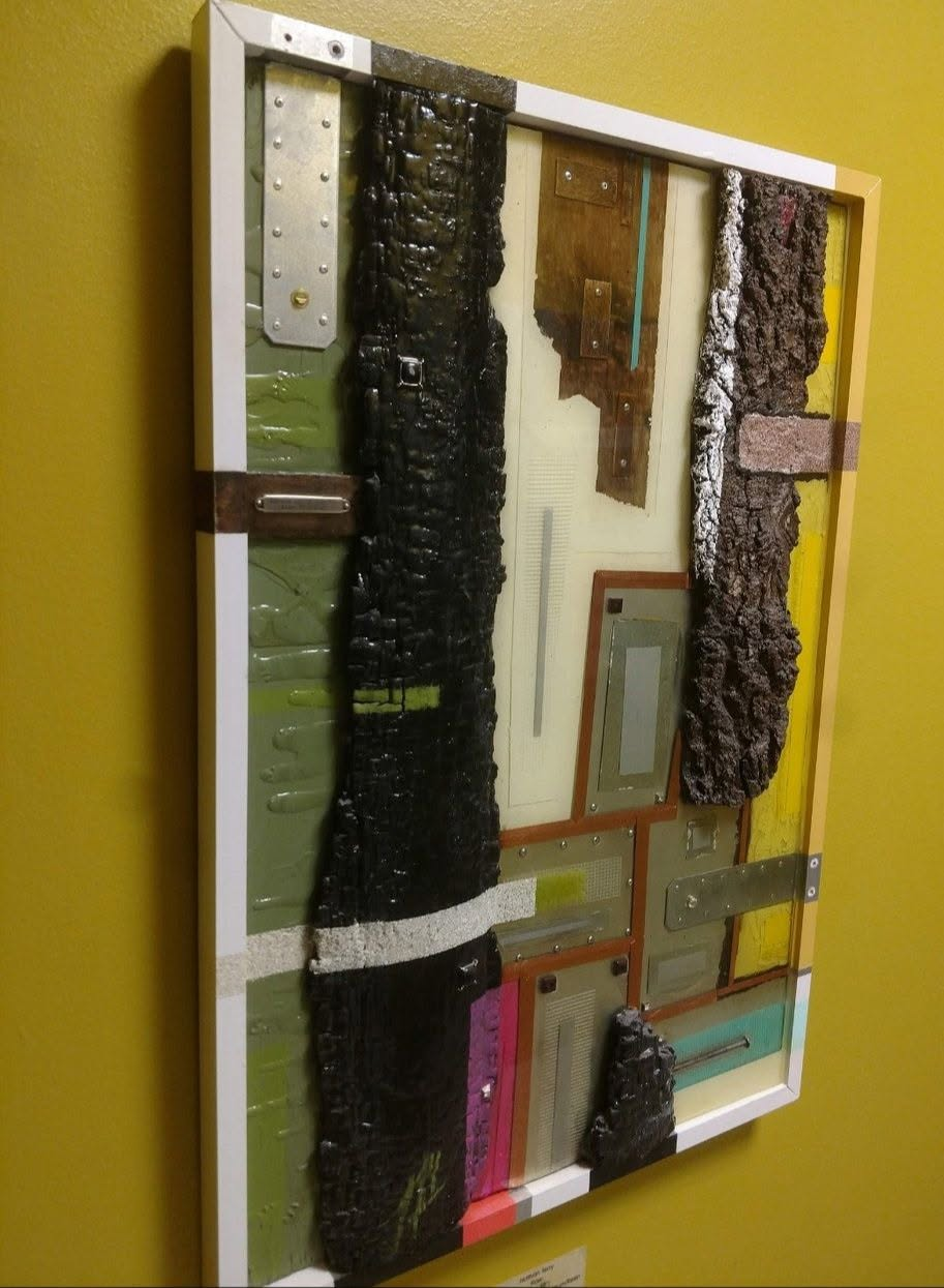 Custom mixed-media artistic wall piece with painted surfaces, textured materials, and metal details by Nathan Terry / NKT Brushed