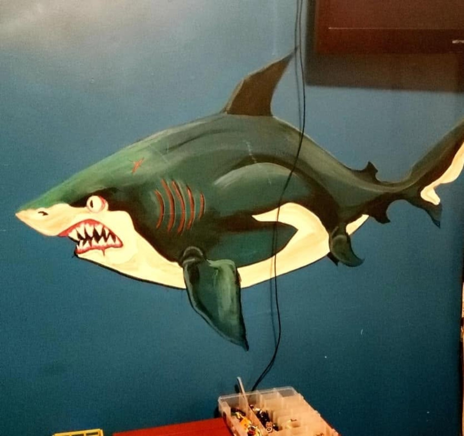 Custom shark character wall mural on deep ocean navy wall - full room perspective