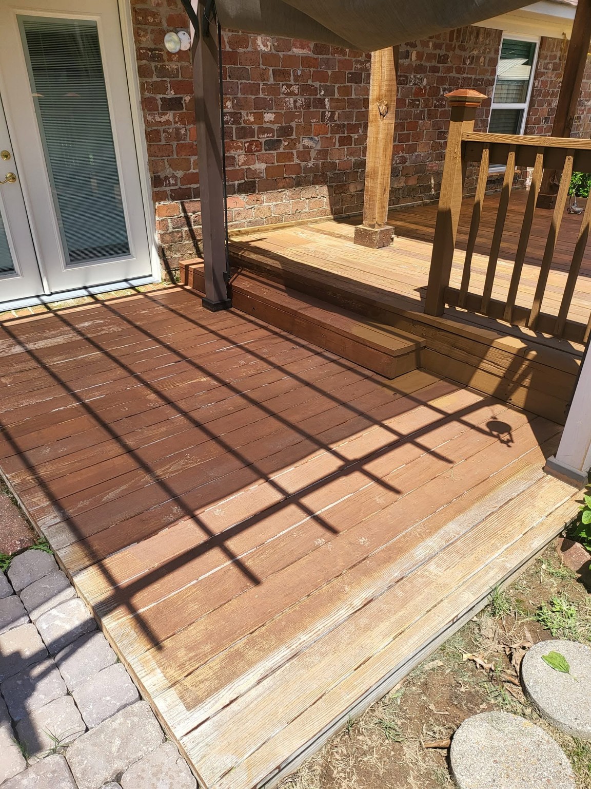 Multi-level deck and pergola before restoration - weathered, faded wood planks