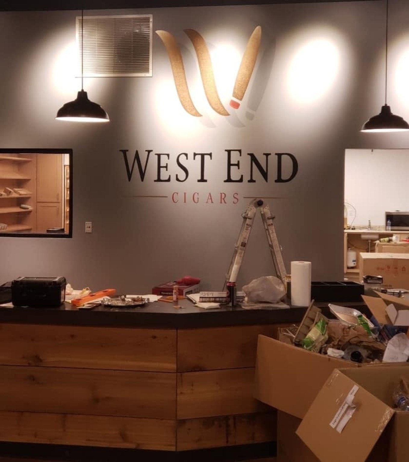 West End Cigars full front desk lobby wall with illuminated branded mural