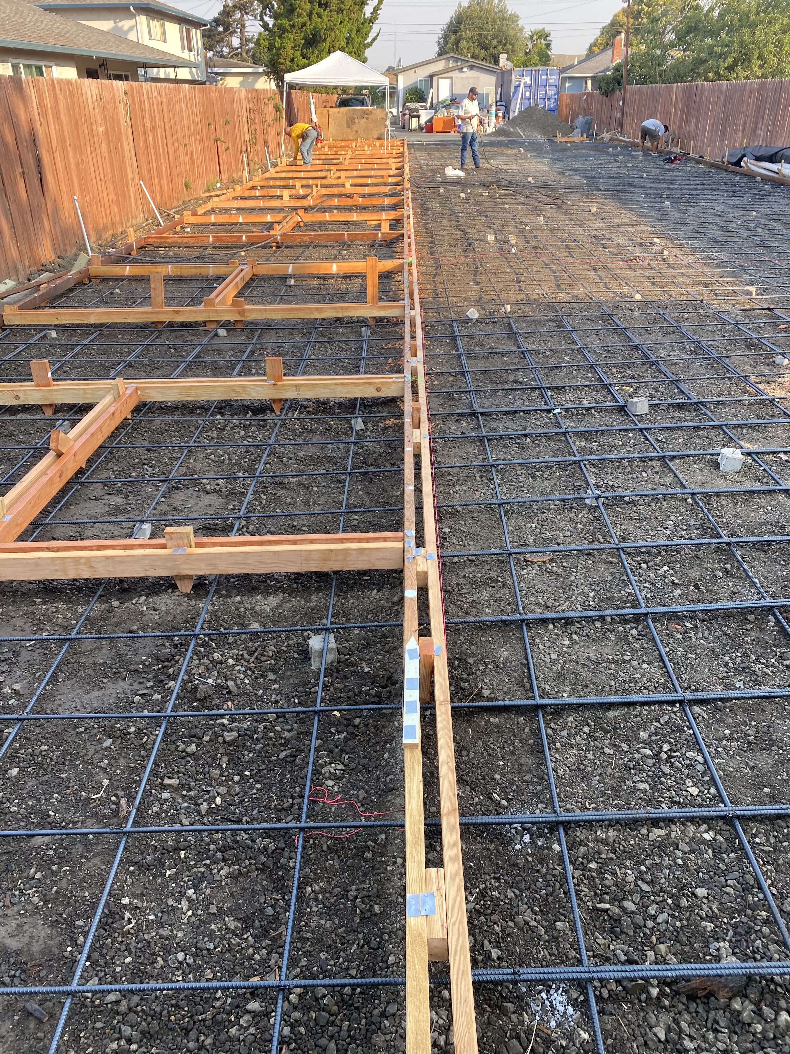 Concrete formwork and rebar reinforcement grid preparation for a large residential pour