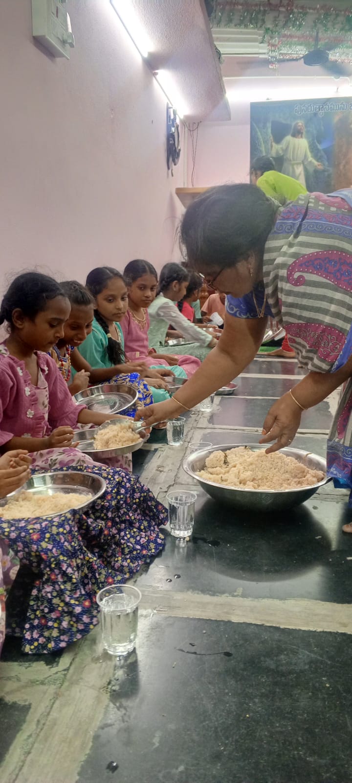 Beaullah Foundation volunteers serving hot nutritious meals to children