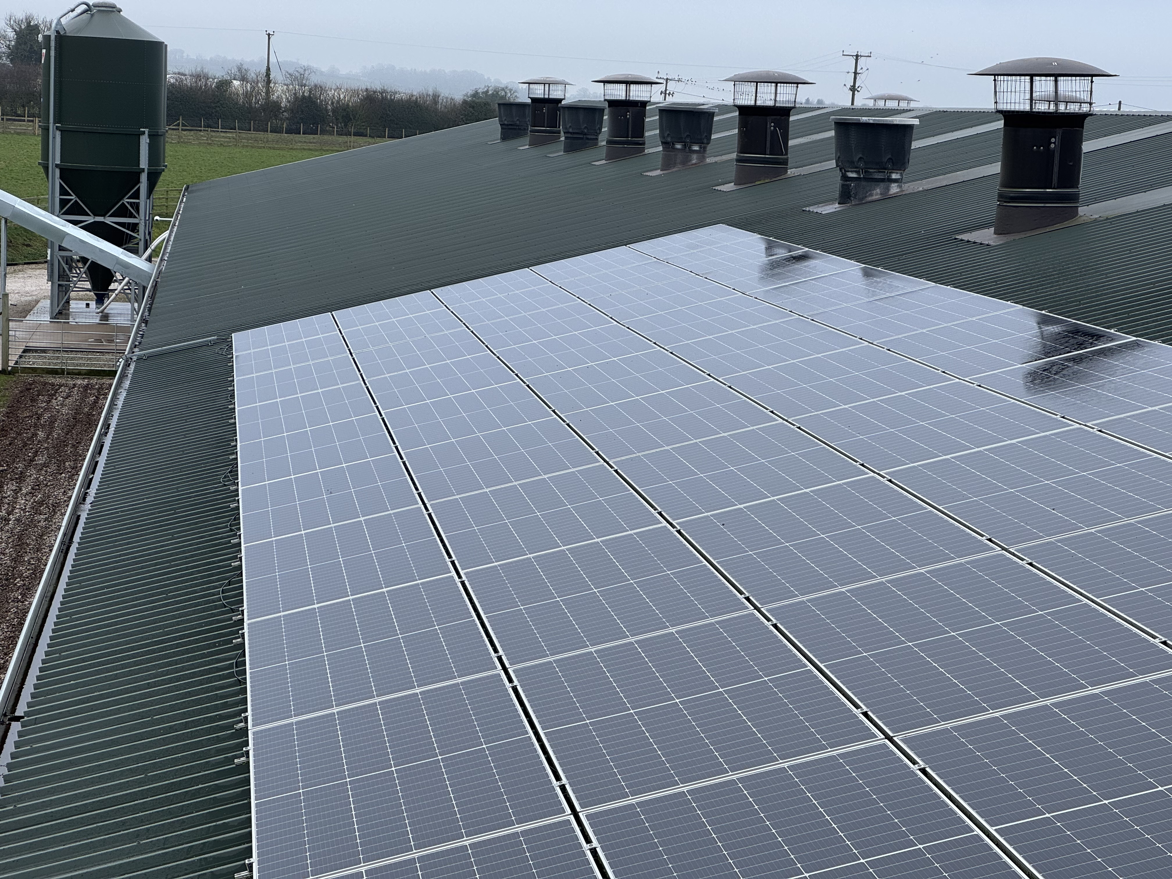 Solar panel clean on an agricultural barn roof