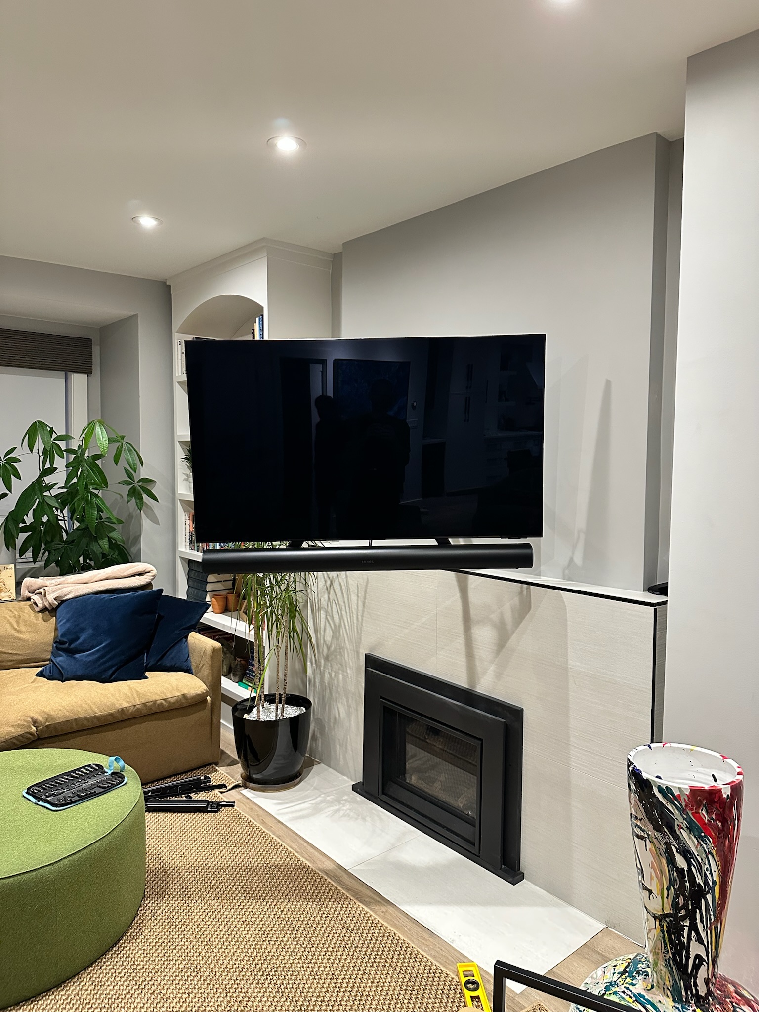 MantelMount pull-down TV installation lowered over fireplace by Mount Masters