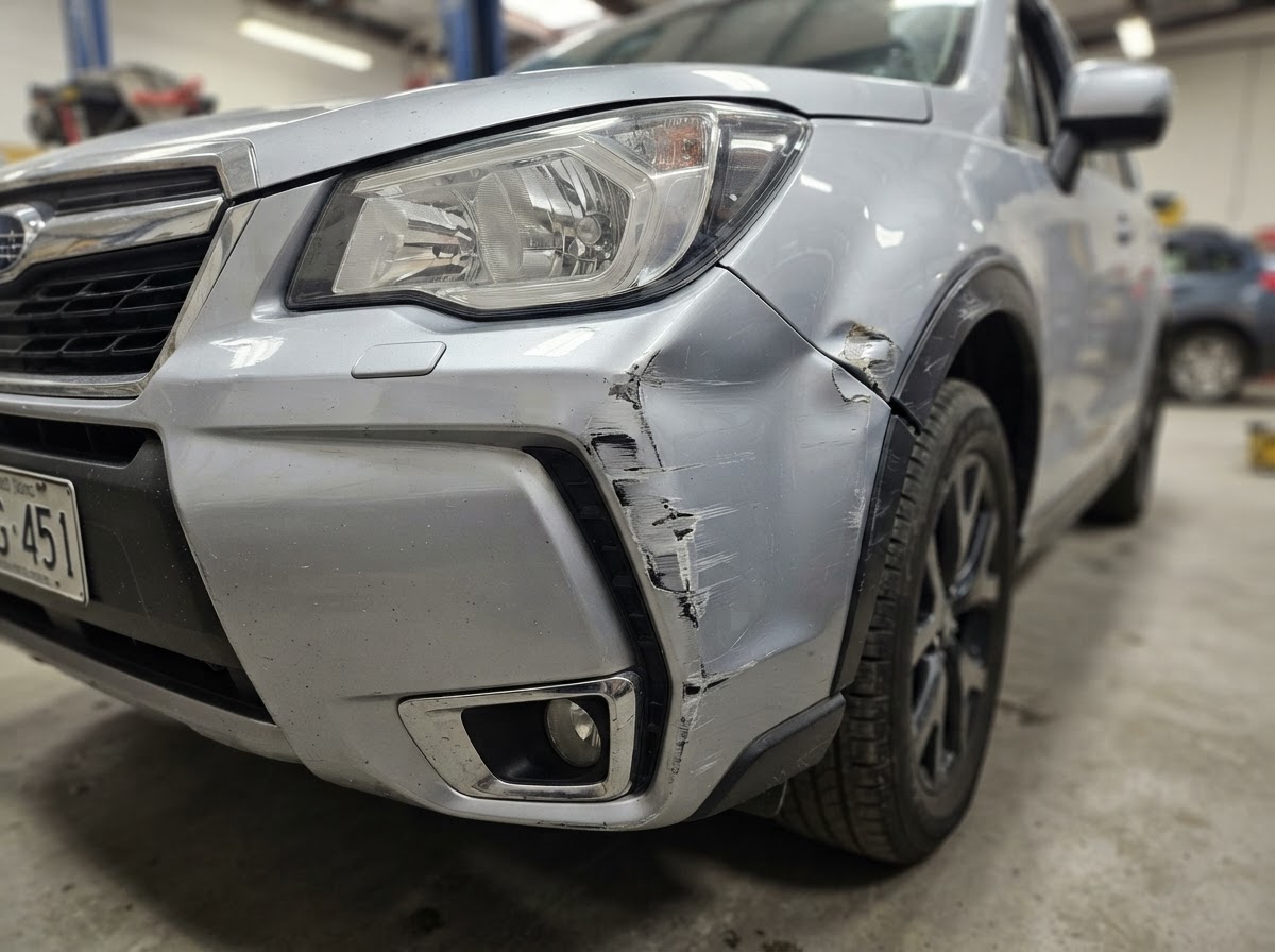 Silver SUV Rear Bumper Repair before repair