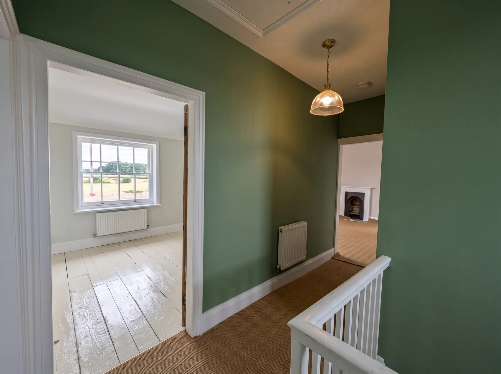 Upstairs hallway at Carters Farm, a listed farmhouse in the New Forest