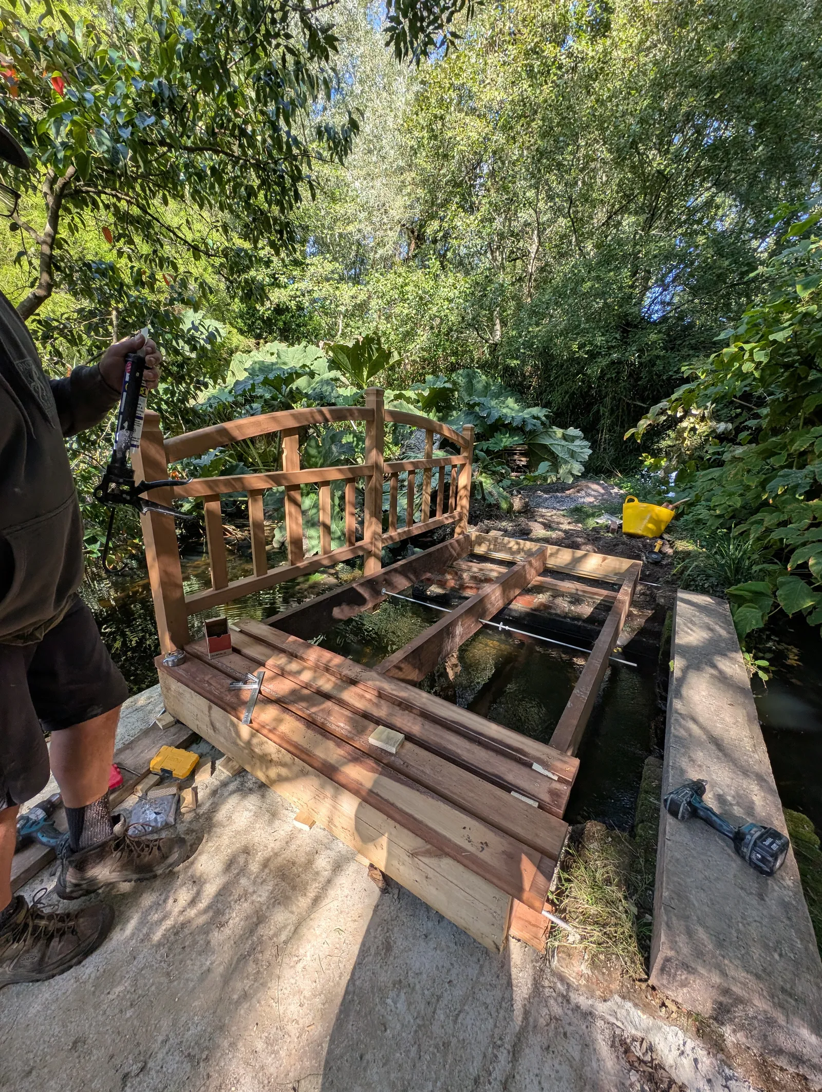 The Bridges at Pylewell Lakes, heritage bridge restoration — the bridge and its reflection