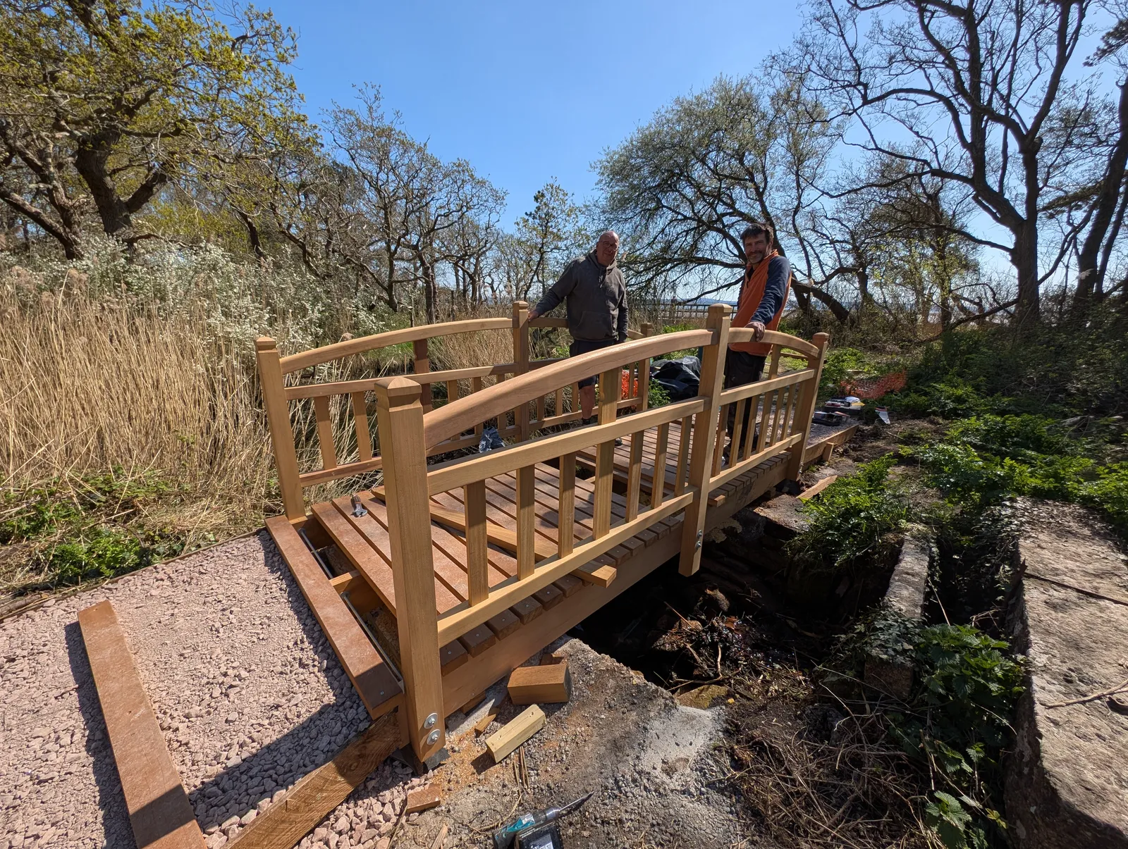 The Bridges at Pylewell Lakes, heritage bridge restoration — the bridge and its reflection