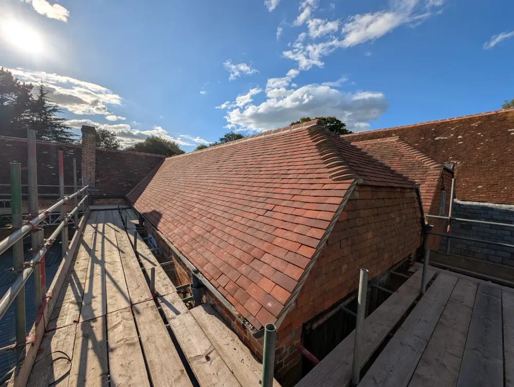 The Mill roof refurbishment and conversion — traditional brick and oak-beam construction