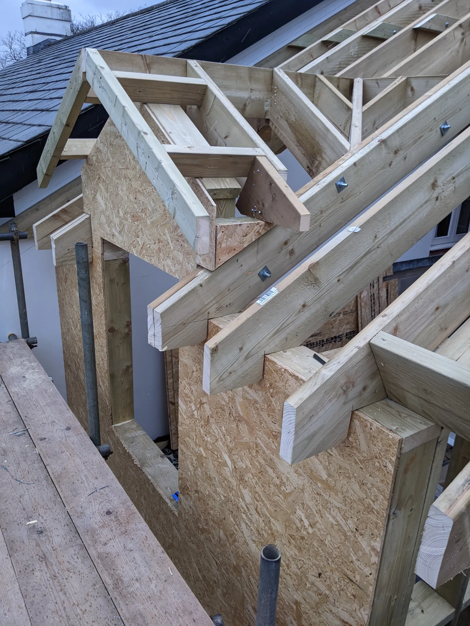 Timber frame of the Peppercorn extension under construction in Sway