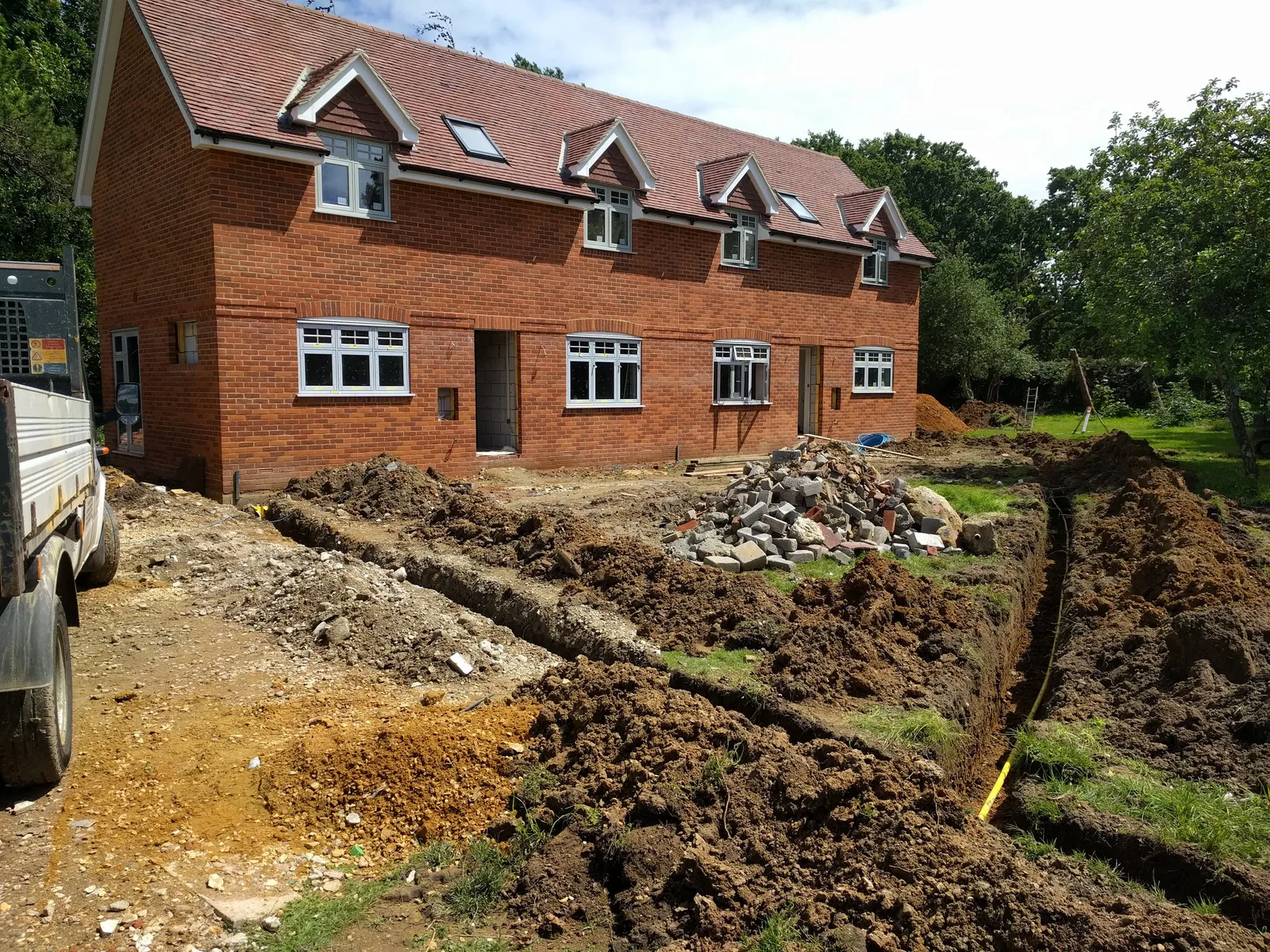 Copse Cottages, new-build brick cottages in the New Forest — brickwork and roof detail