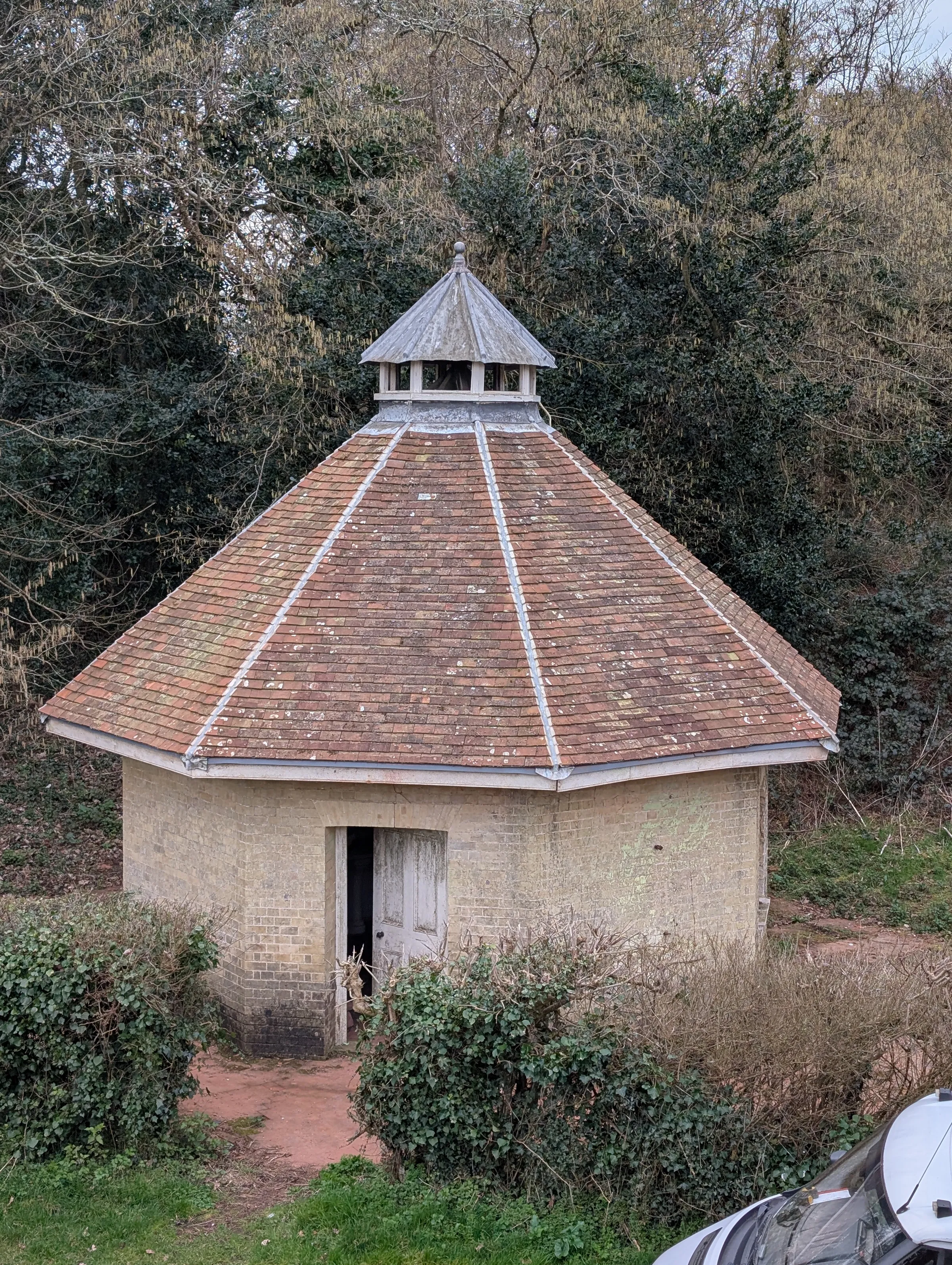 The Dairy at Pylewell Park, a historic octagonal outbuilding undergoing roof refurbishment and sympathetic repair