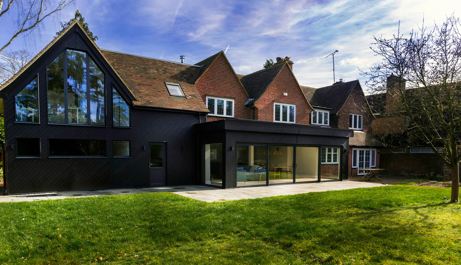 Peppercorn, a black timber-clad extension at Sway in the New Forest