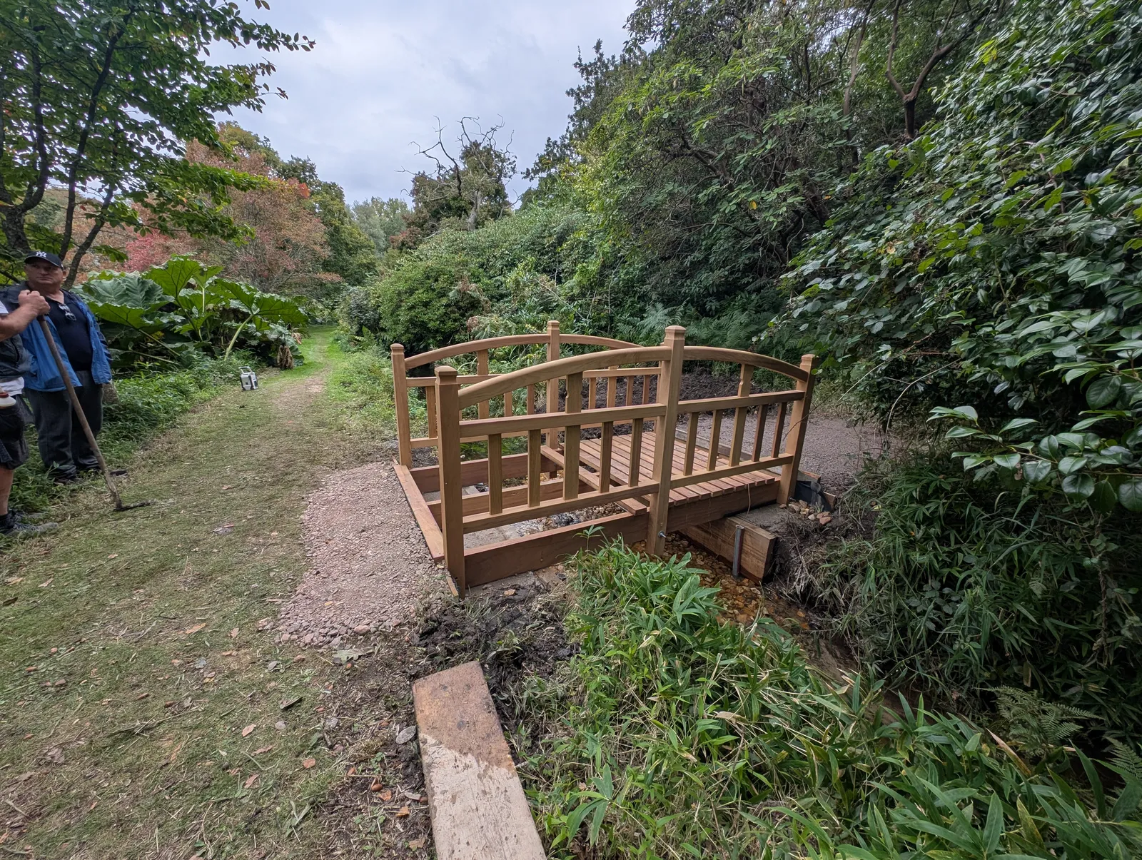 The Bridges at Pylewell Lakes, heritage bridge restoration — the bridge and its reflection