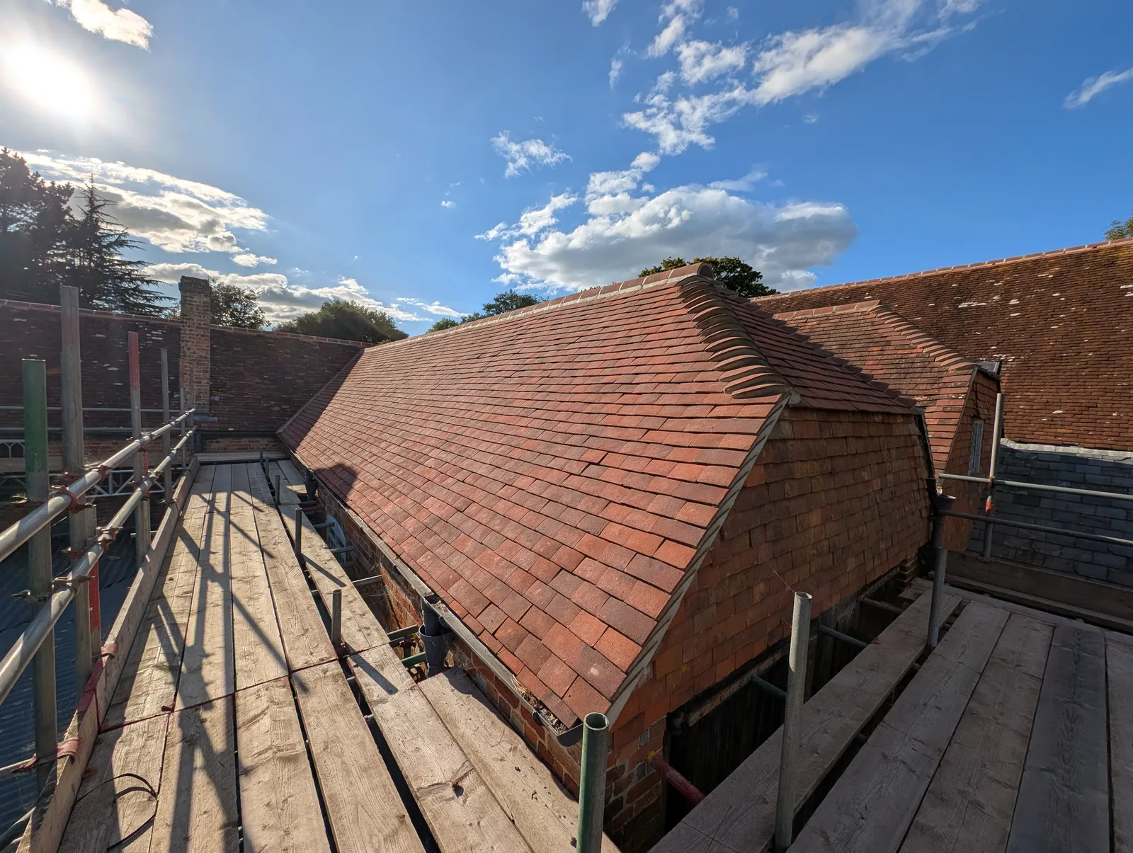 The Mill roof refurbishment and conversion — traditional brick and oak-beam construction