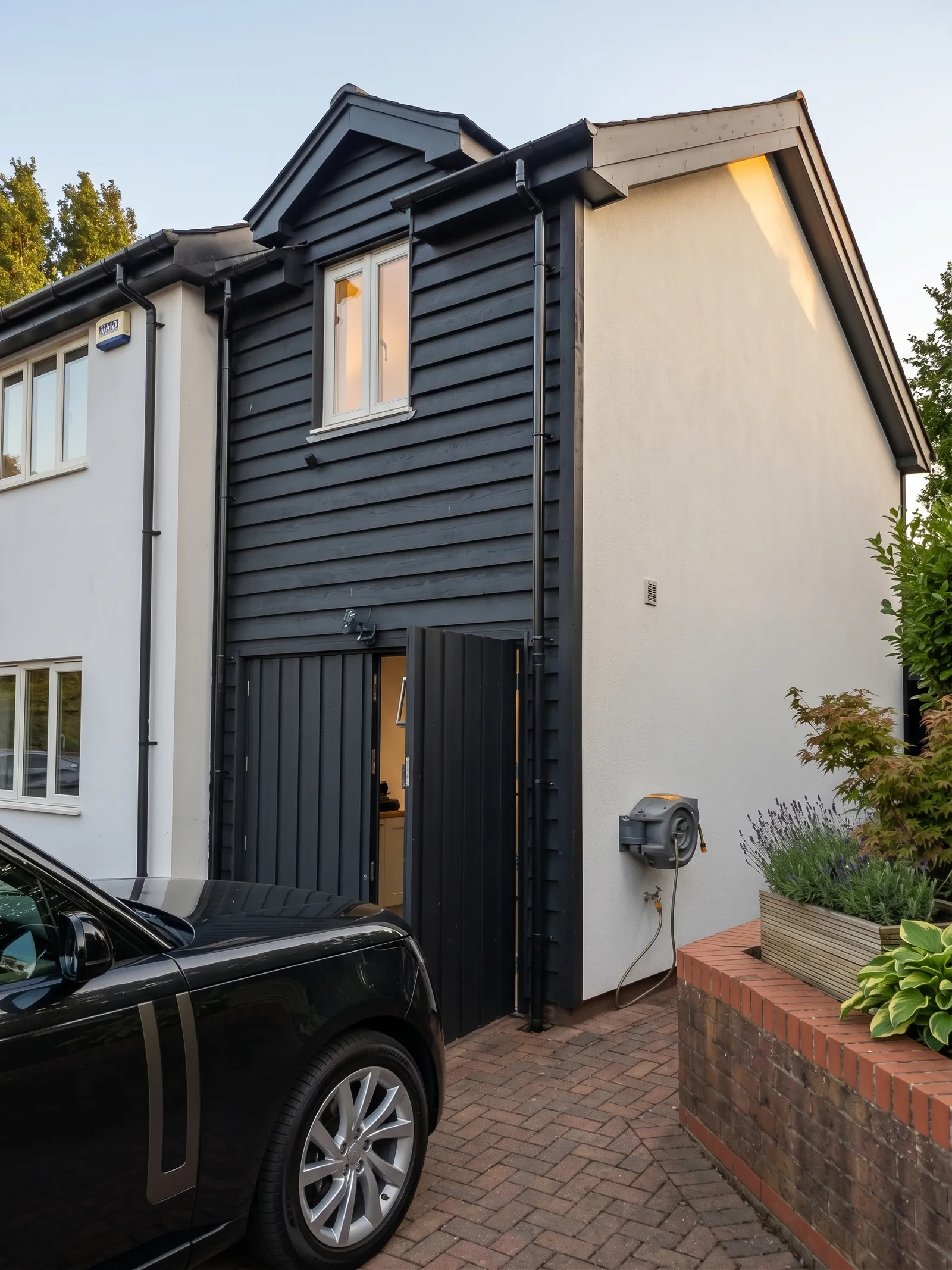 Exterior of the Peppercorn extension, a timber-clad addition in Sway