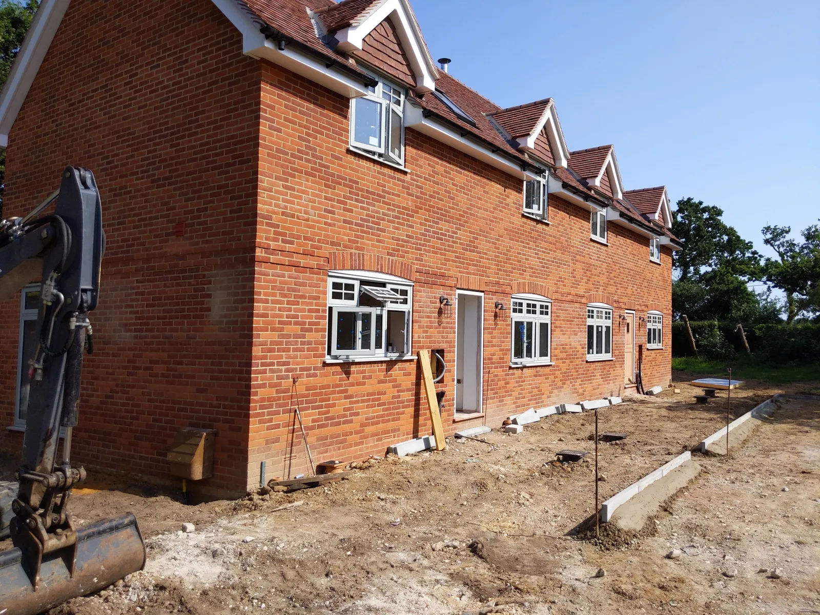 Copse Cottages, new-build brick cottages in the New Forest — the brick elevations of the cottages