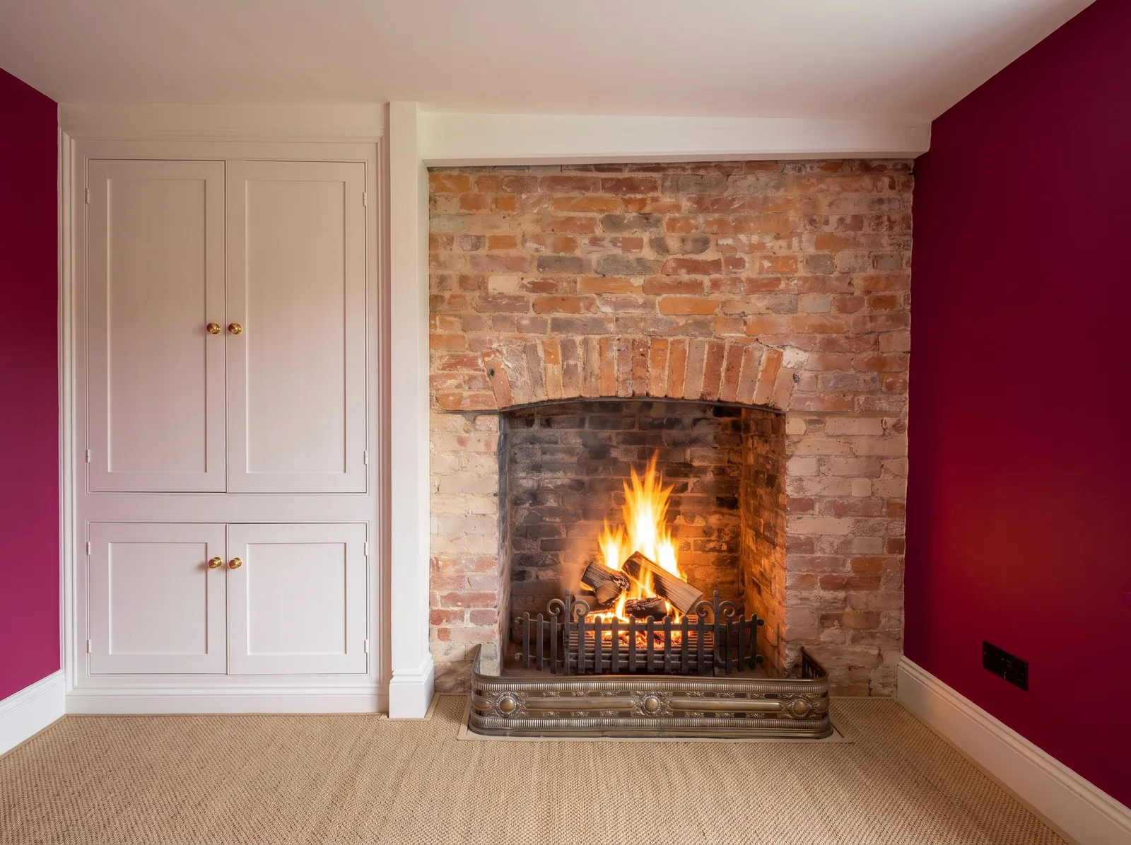 Fireplace detail in the study at Carters Farm, Norley Wood