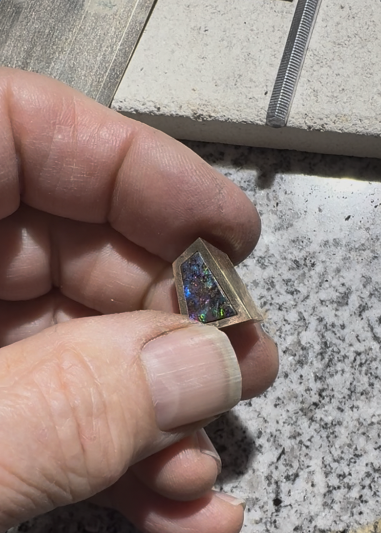 Mitred 14K gold frame with the boulder opal back-set
