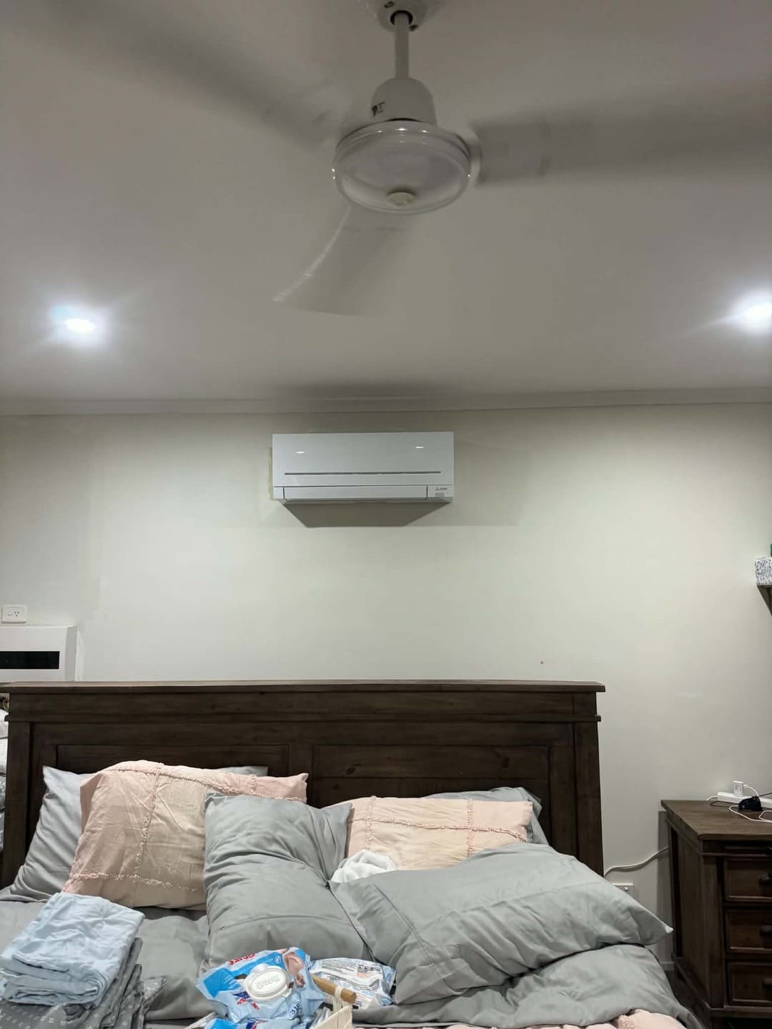 Split system air conditioning wall unit installation in bedroom by Total Blackout Electrical