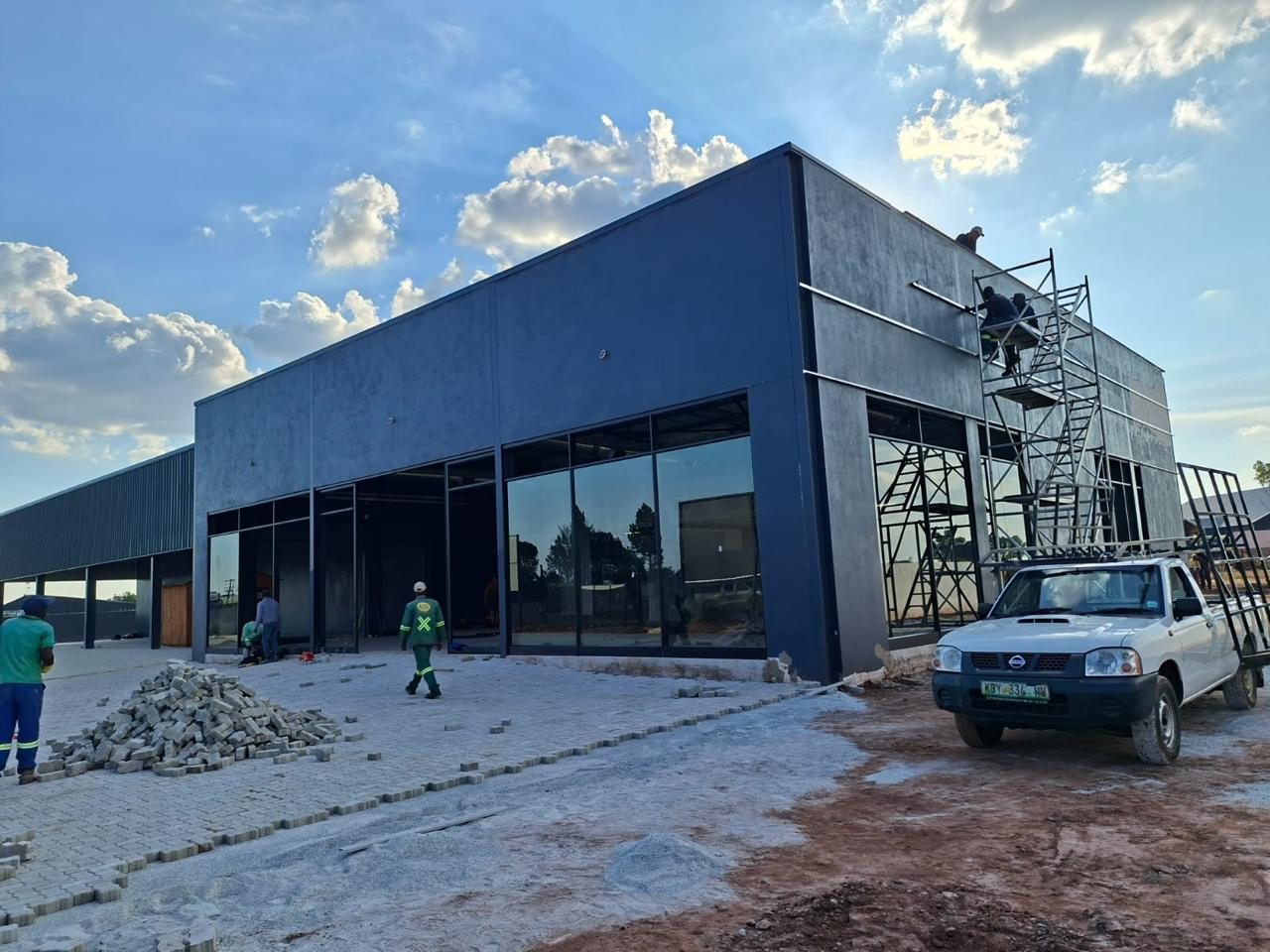 Dealership build nearing completion with crew on site
