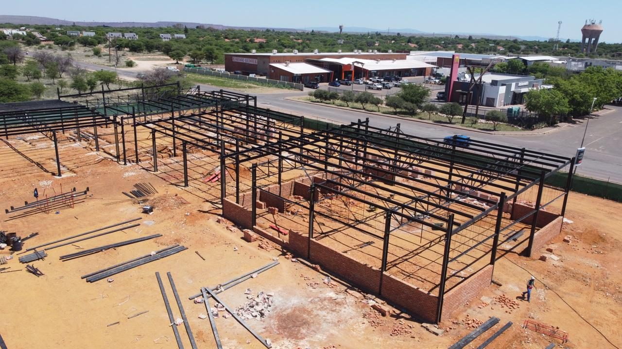 Aerial view of steel portal frames going up at the Kathu dealership site