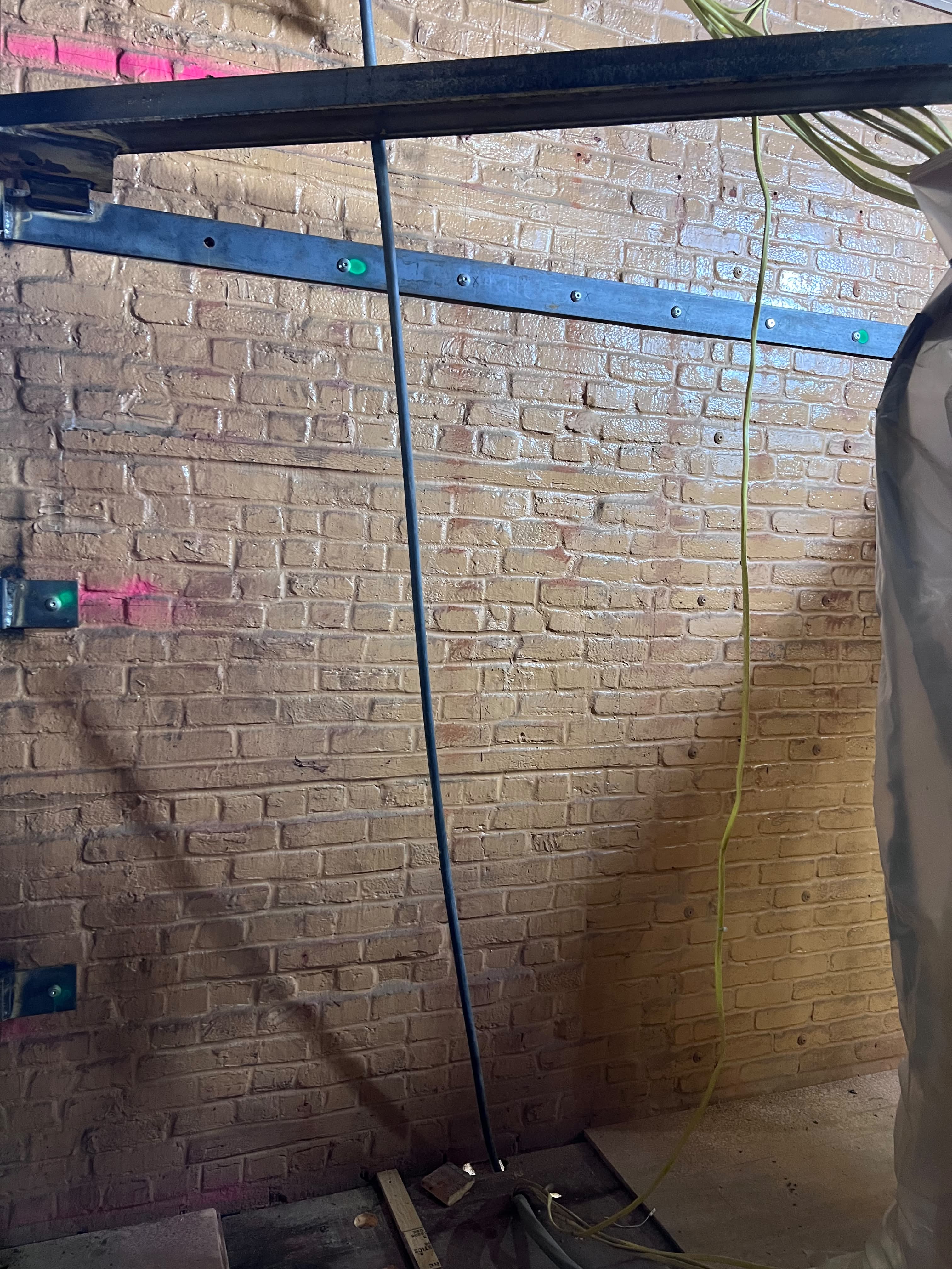Heavy duty structural steel channel and steel beam anchoring on brick wall by LQJ General Construction in Central Islip NY