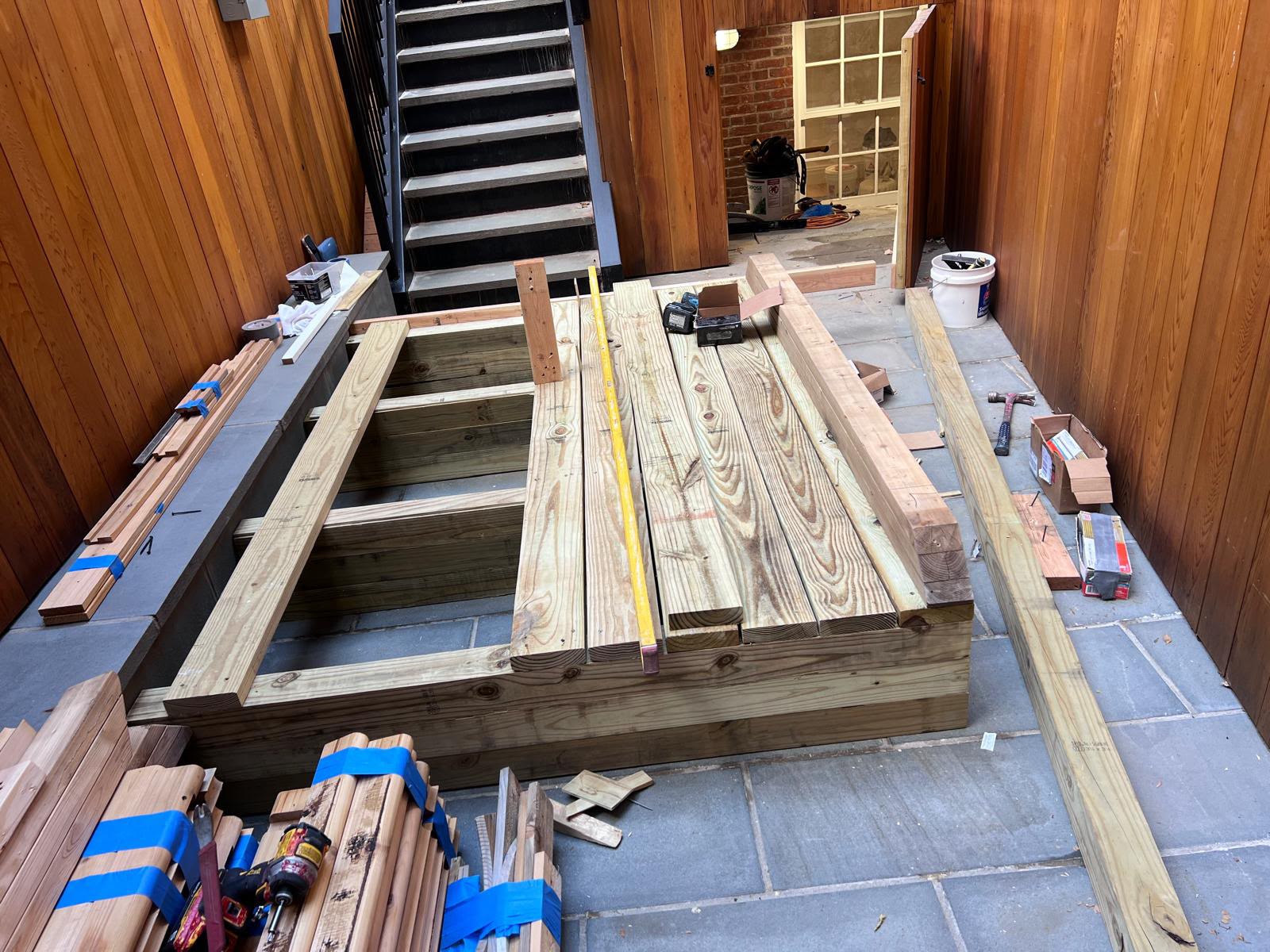 Precision leveled pressure-treated wood deck sleeper platform framing by LQJ General Construction in Northport NY