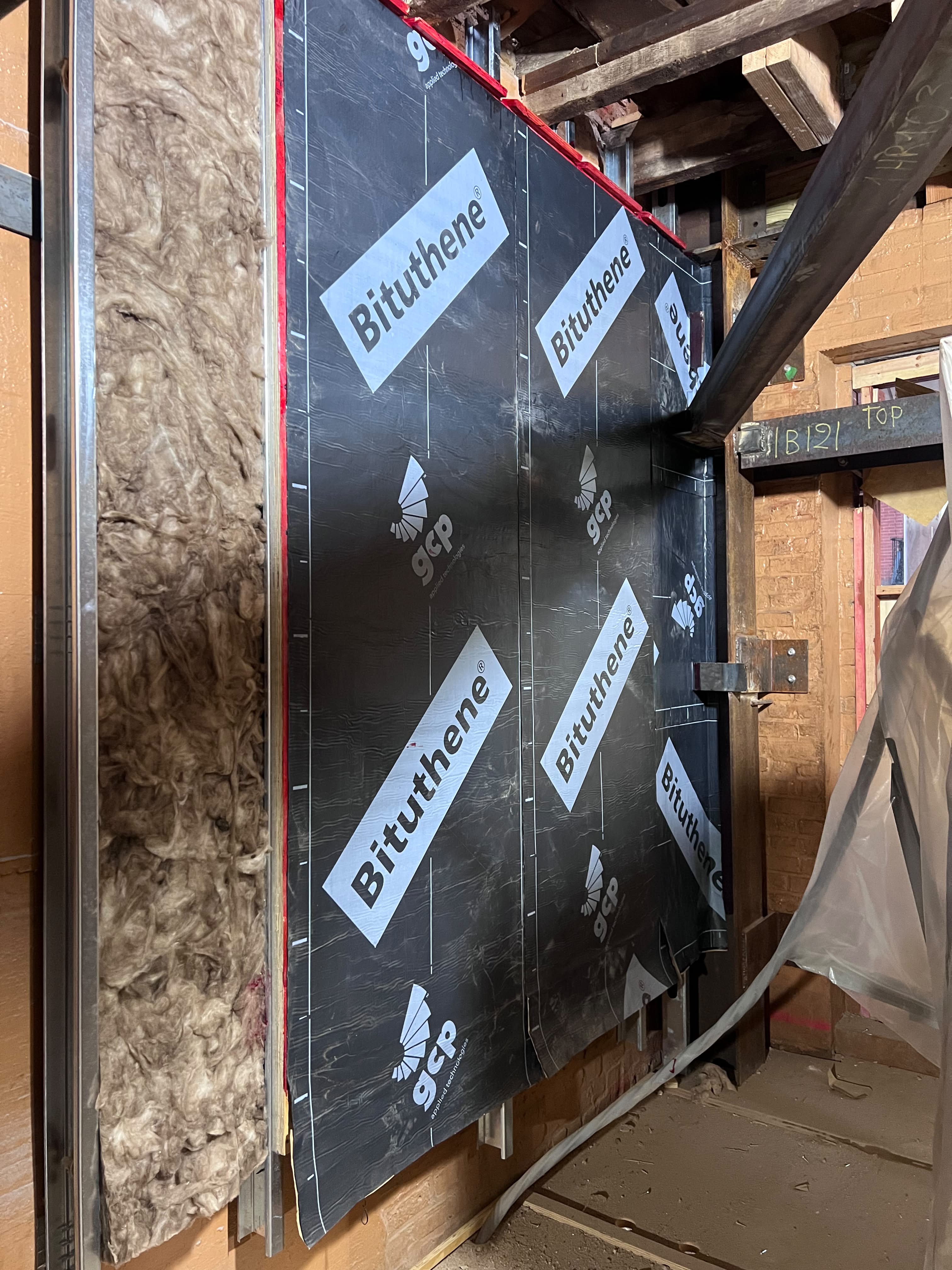 Bituthene vapor and waterproofing membrane barrier on steel beam by LQJ General Construction in Commack NY