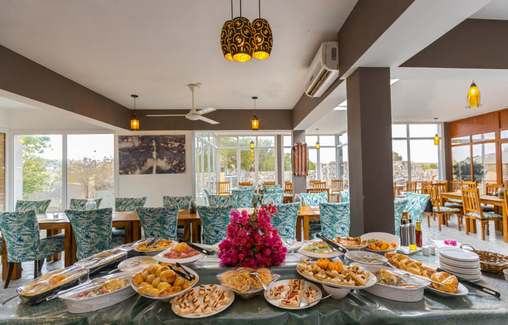 Outdoor terrace dining with mountain view