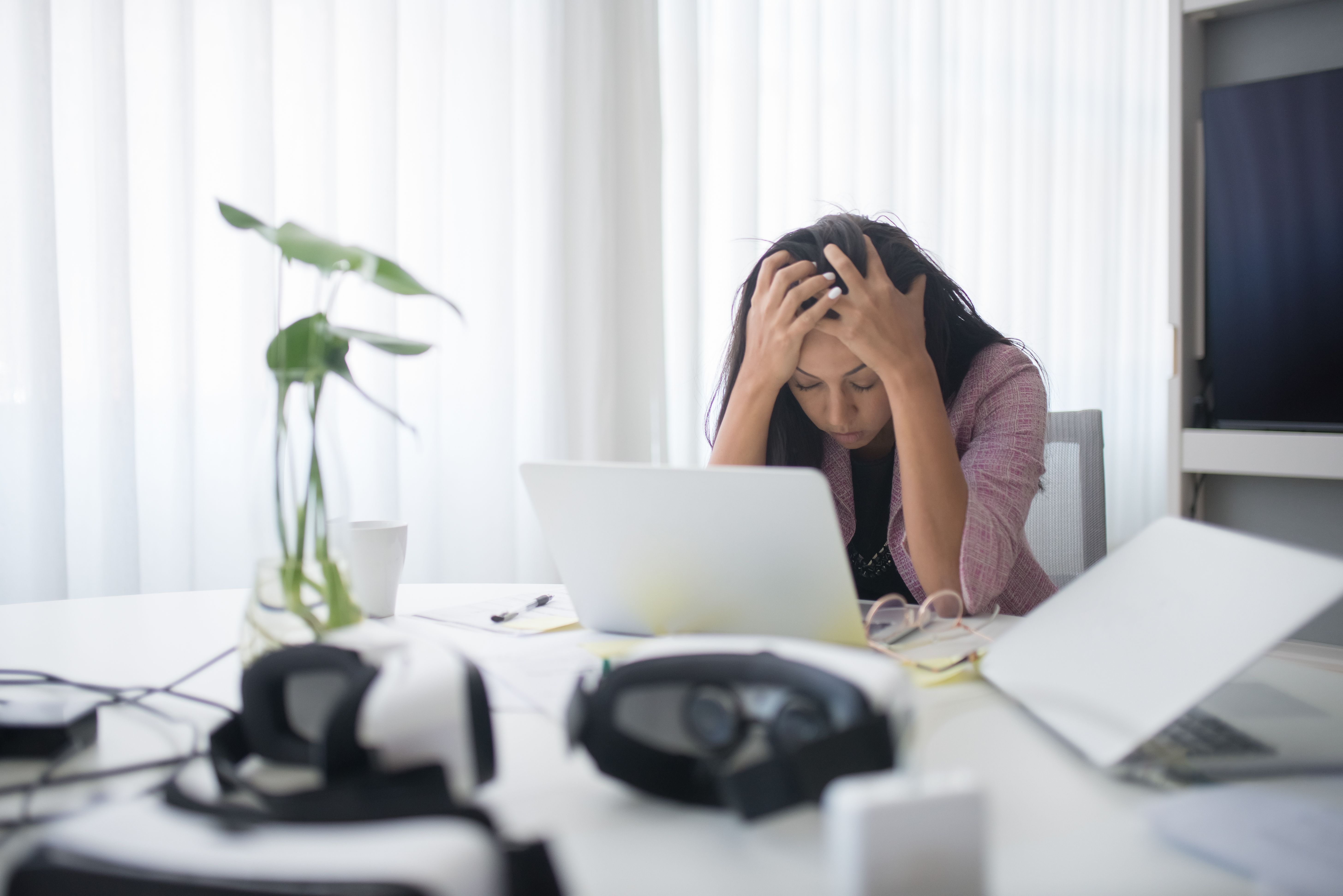 Stressed business owner dealing with tax and paperwork