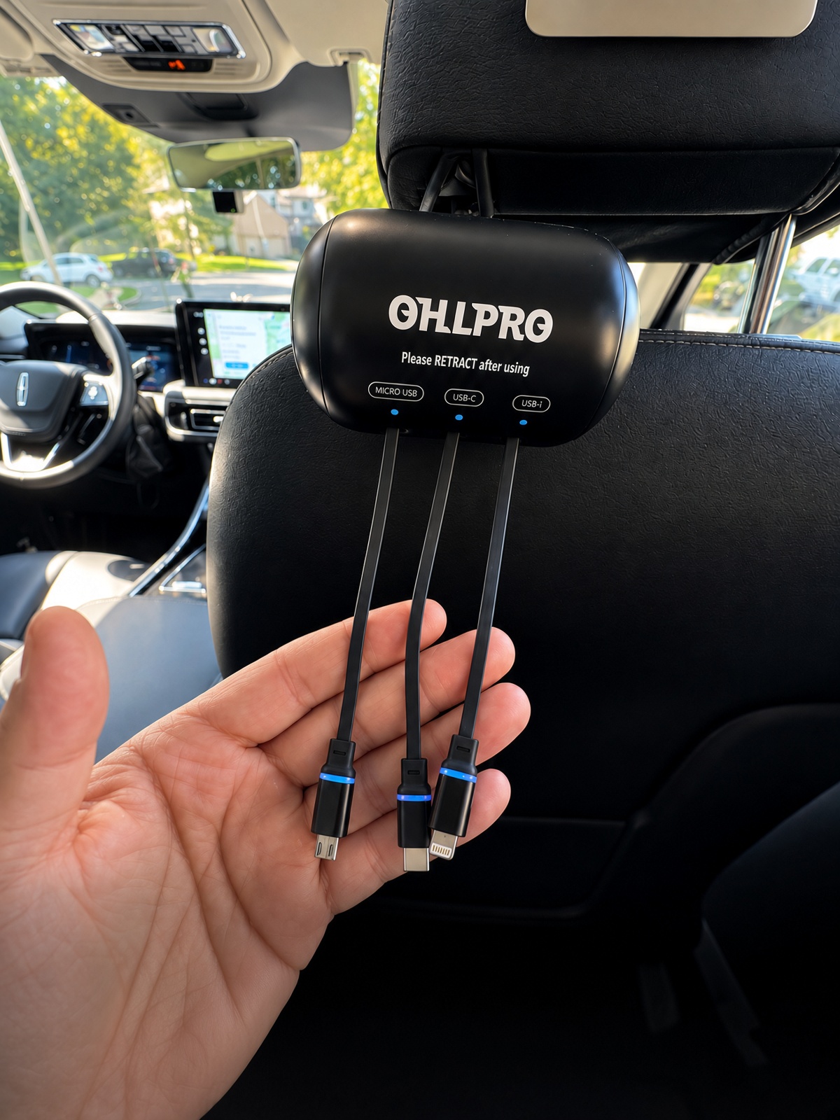 Retractable multi-device fast charger station (Micro USB, USB-C, Lightning) mounted in Lincoln Aviator