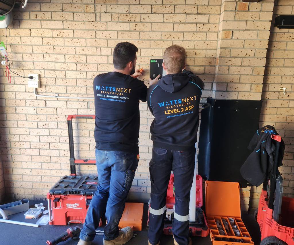 Watts Next Electrical Level 2 ASP contractors performing commercial EV charger installation on-site