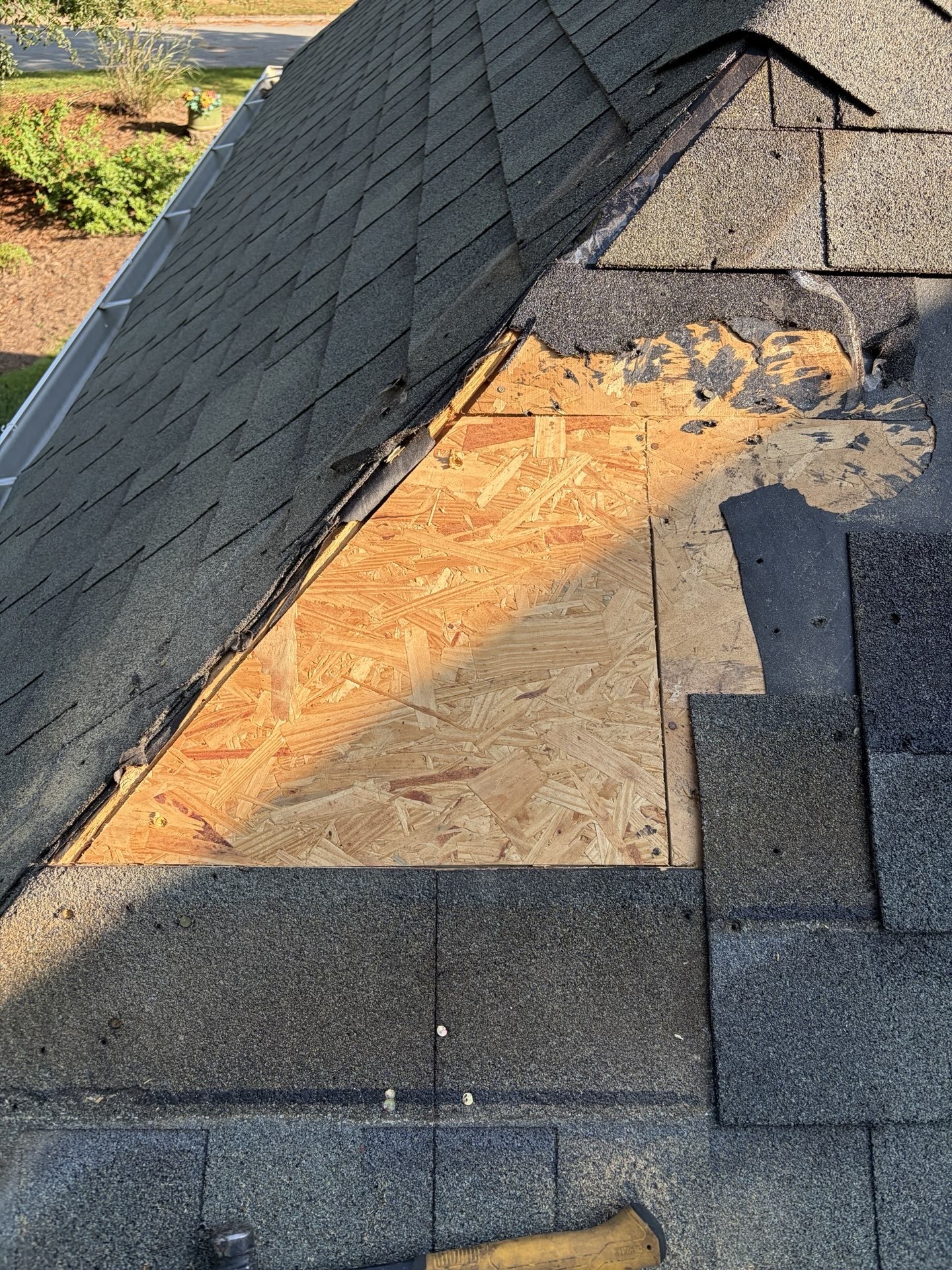Damaged shingle and roof decking repair in Peachtree City, GA