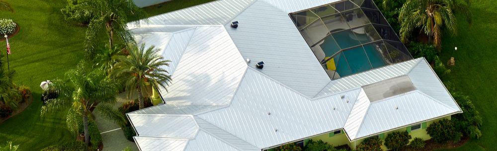 Aerial view of residential home with standing seam metal roof in Southwest Florida