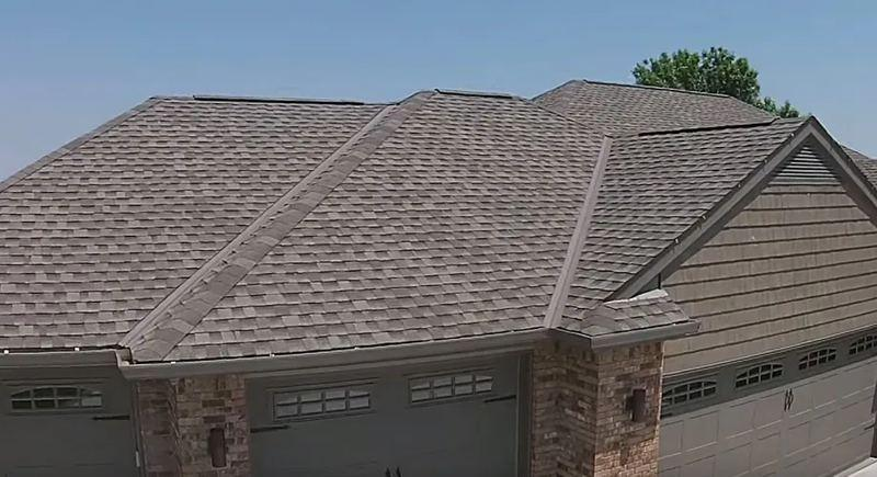 Architectural shingle roof installation with clean ridge vents