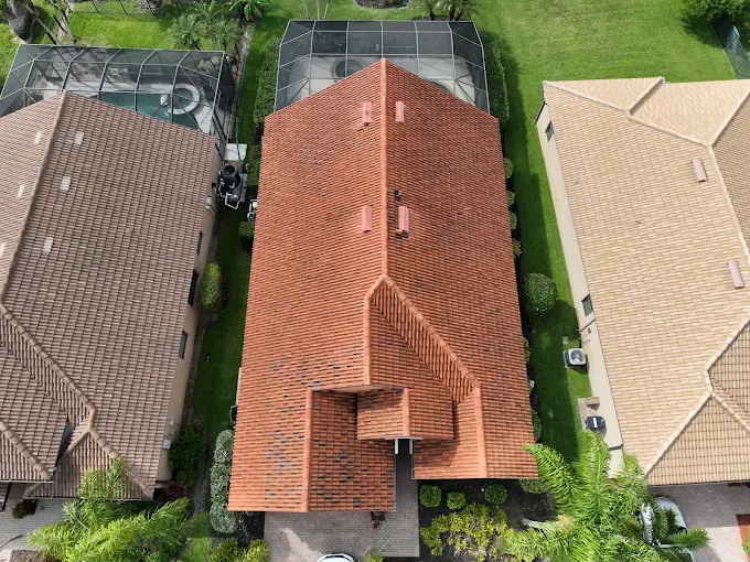 Aerial view of completed terracotta tile roof on home