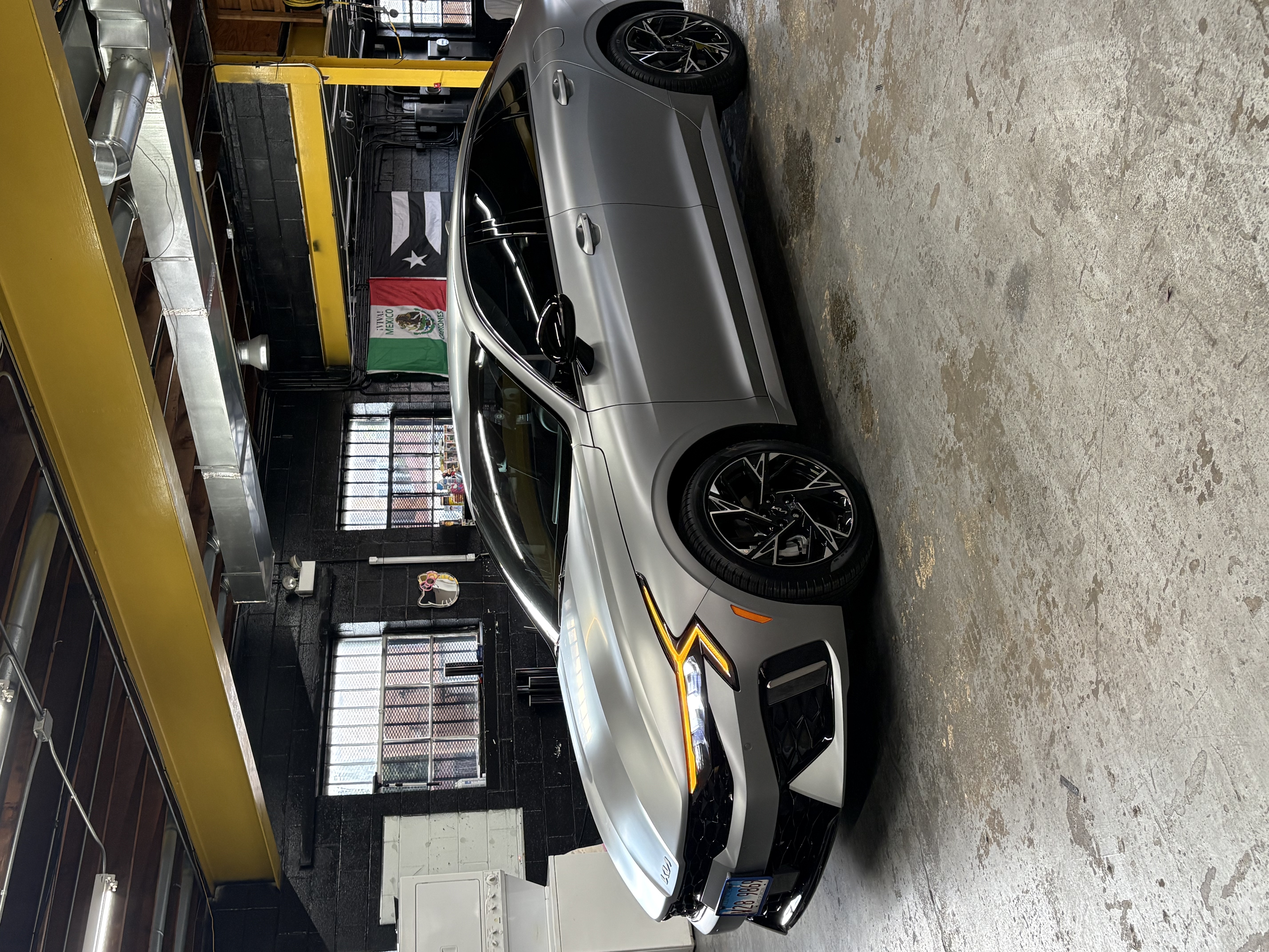 Matte Silver Kia K5 in Shop Bay
