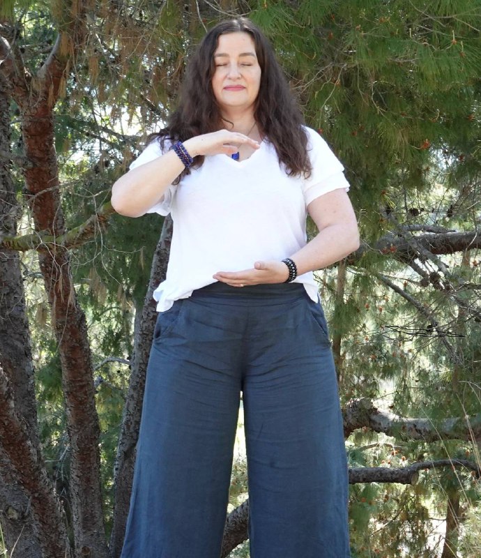 Dr. Christine Sanmiquel practicing Qigong outdoors