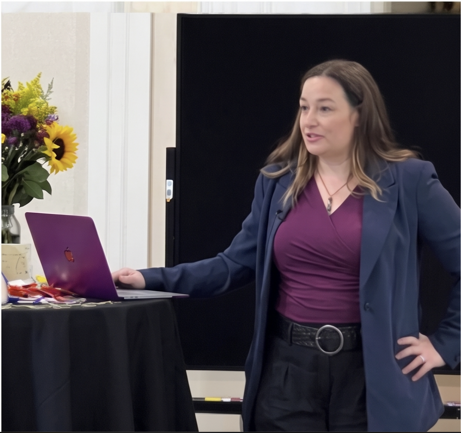 Dr. Christine Sanmiquel speaking and presenting at an event
